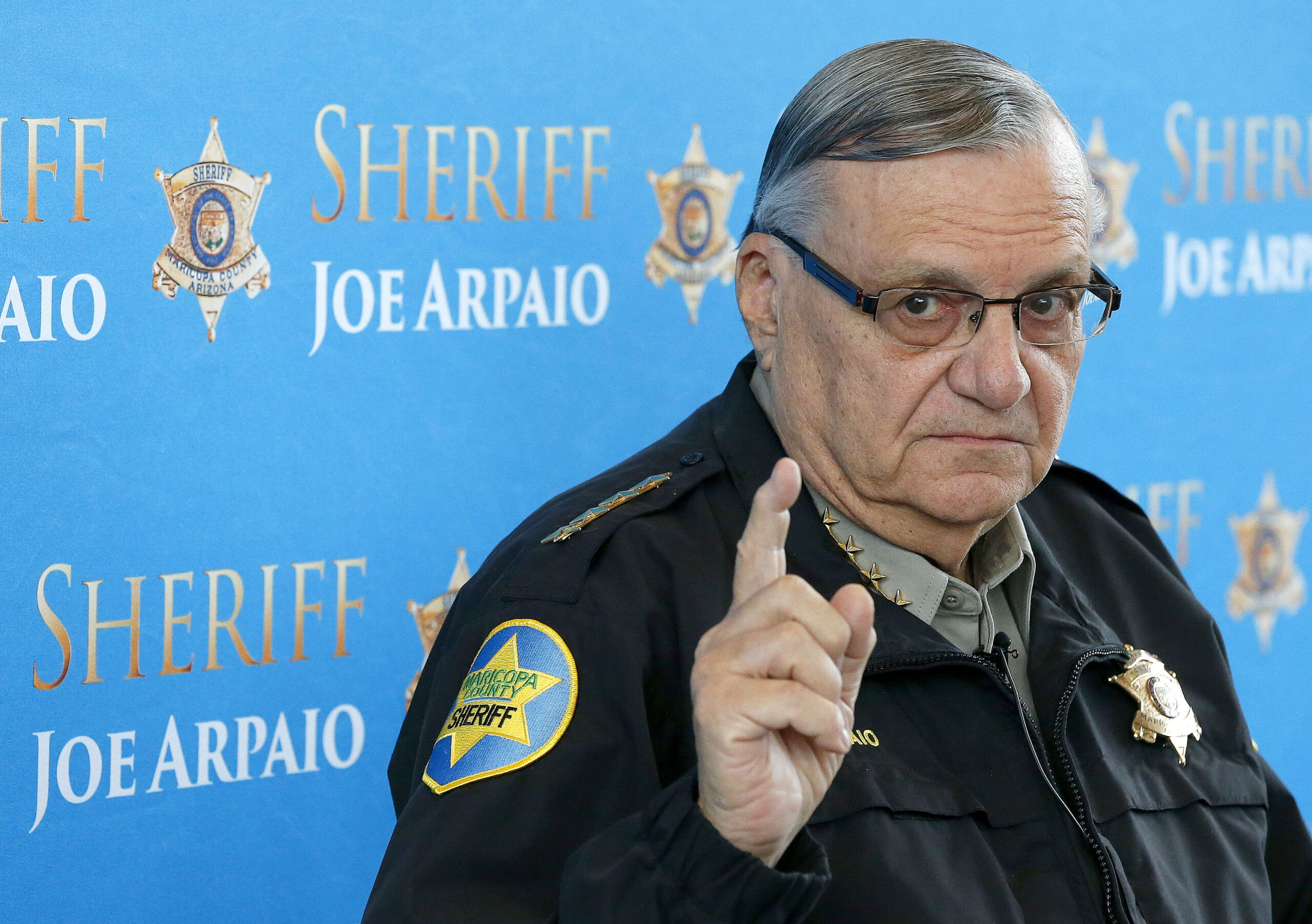 FILE - In this Dec. 18, 2013, file photo, Maricopa County Sheriff Joe Arpaio pauses as he answers a question at a news conference at Maricopa County Sheriff's Office Headquarters in Phoenix. Nearly five years after Arpaio was voted out as sheriff of Arizona's most populous county, taxpayers are covering one of the last major bills from the thousands of lawsuits the lawman's headline-grabbing tactics inspired. (AP Photo/Ross D. Franklin, File)