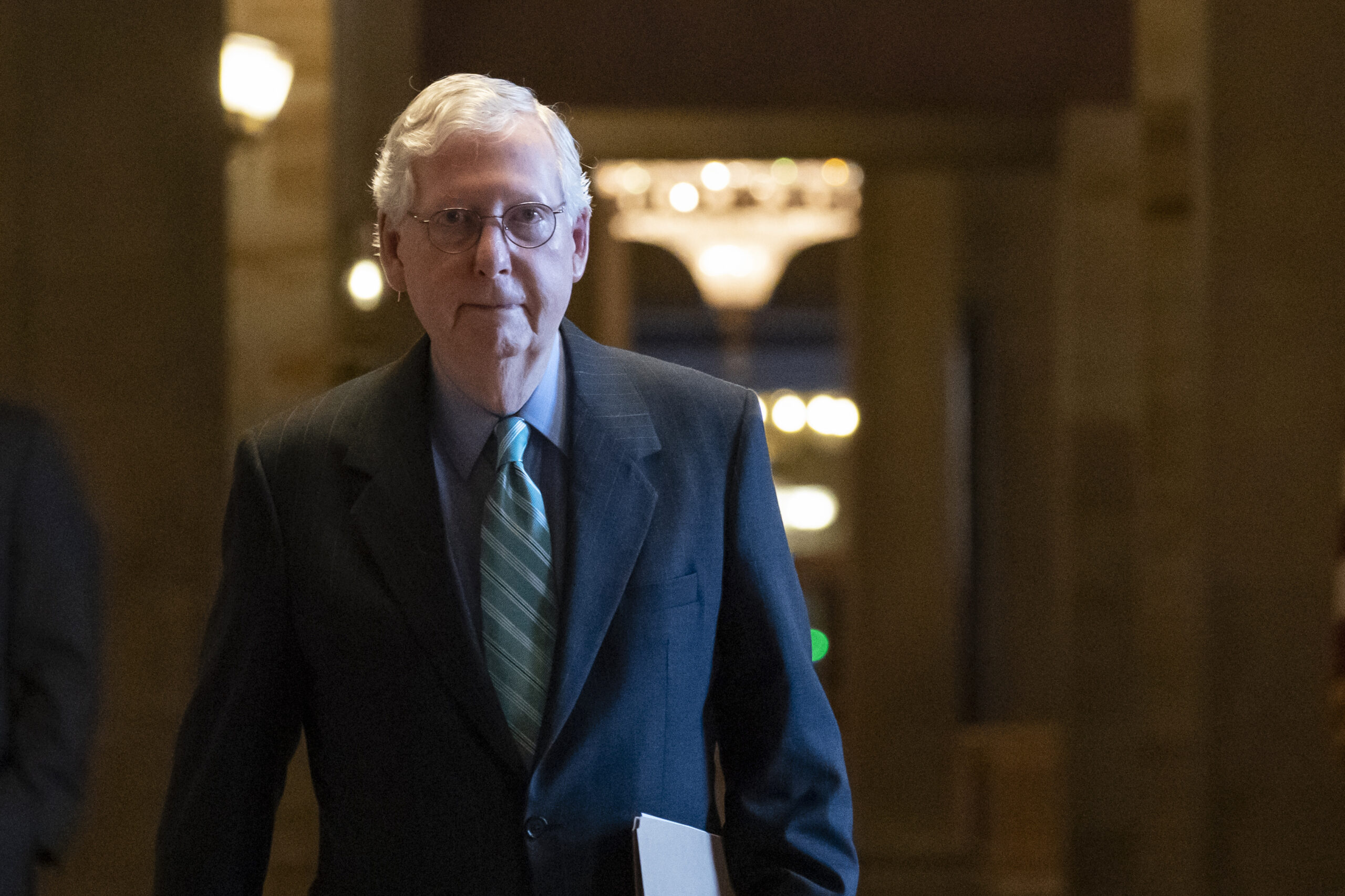 Senate Minority Leader Mitch McConnell, R-Ky., leaves the chamber after speaking, at the Capitol in Washington, Thursday, Oct. 7, 2021. Republican and Democratic senators have edged back from a perilous standoff over lifting the nation's borrowing cap and will likely extend the deadline until December. (AP Photo/Alex Brandon)