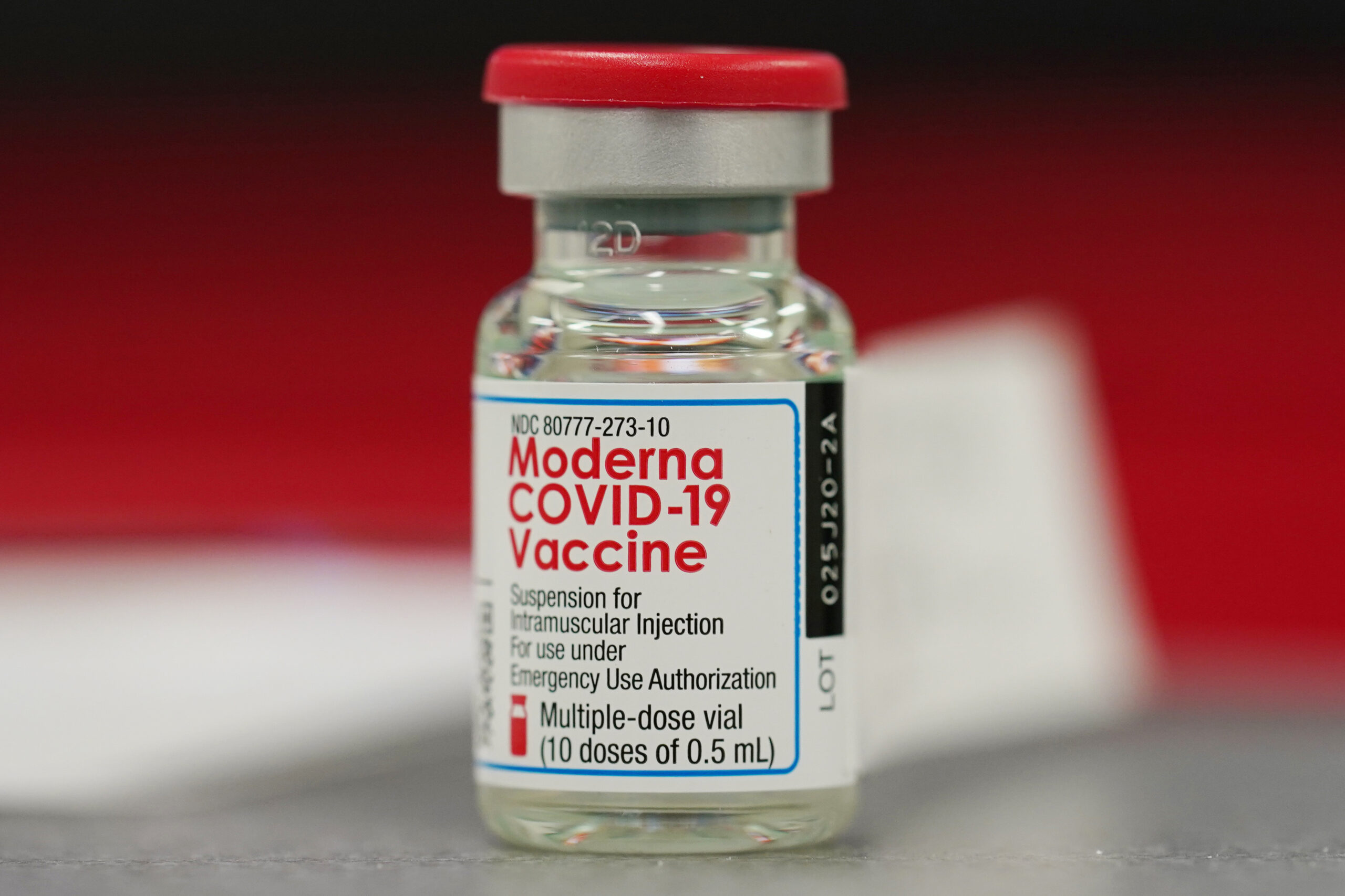 FILE - This Dec. 23, 2020 file photo shows a vial of the Moderna COVID-19 vaccine in the first round of staff vaccinations at a hospital in Denver. Federal regulators are expected to authorize the mixing and matching of COVID-19 booster shots this week in an effort to provide flexibility for those seeking to maintain protection against the coronavirus. The upcoming announcement by the Food and Drug Administration is likely to come along with authorization for boosters of the Moderna and Johnson & Johnson shots. (AP Photo/David Zalubowski, File)
