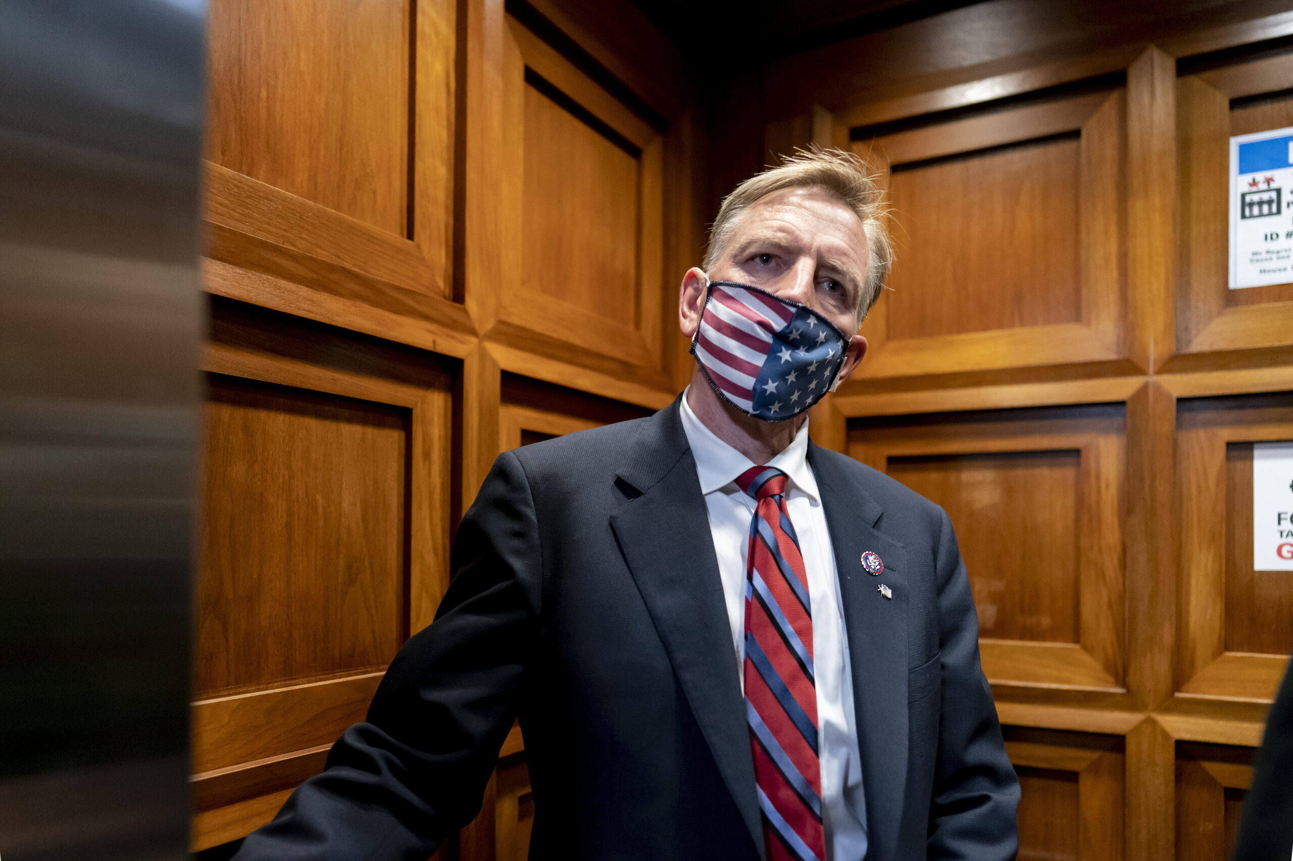 Republican Rep. Paul Gosar of Arizona, takes an elevator as the House of Representatives prepares to vote on a resolution to formally rebuke him for tweeting an animated video that depicted him striking Rep. Alexandria Ocasio-Cortez, D-N.Y., with a sword, on Capitol Hill in Washington, Wednesday, Nov. 17, 2021. In addition to the official censure, House Democrats want to oust him from his seats on the House Oversight Committee and the Natural Resources Committee. (AP Photo/J. Scott Applewhite)