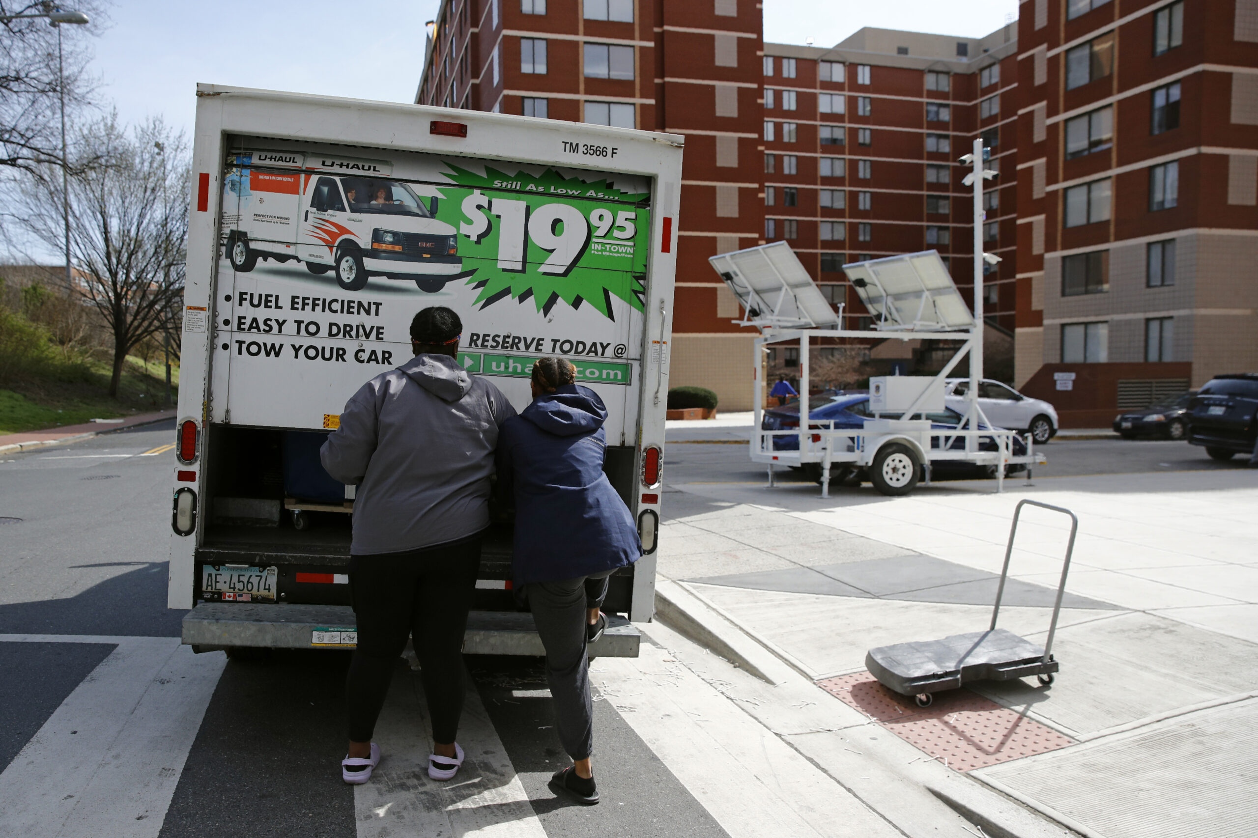 FILE - Students finish loading belongings into a U-Haul truck as they move out of their dorm in Washington on March 18, 2020. The proportion of people who moved over the past year fell to its lowest rate in the 73 years that it has been tracked, in a refutation of popular anecdotes that there was a great migration in the U.S. during the pandemic, according to figures released Wednesday, Nov. 17, 2021 by the U.S. Census Bureau. (AP Photo/Patrick Semansky, File)
