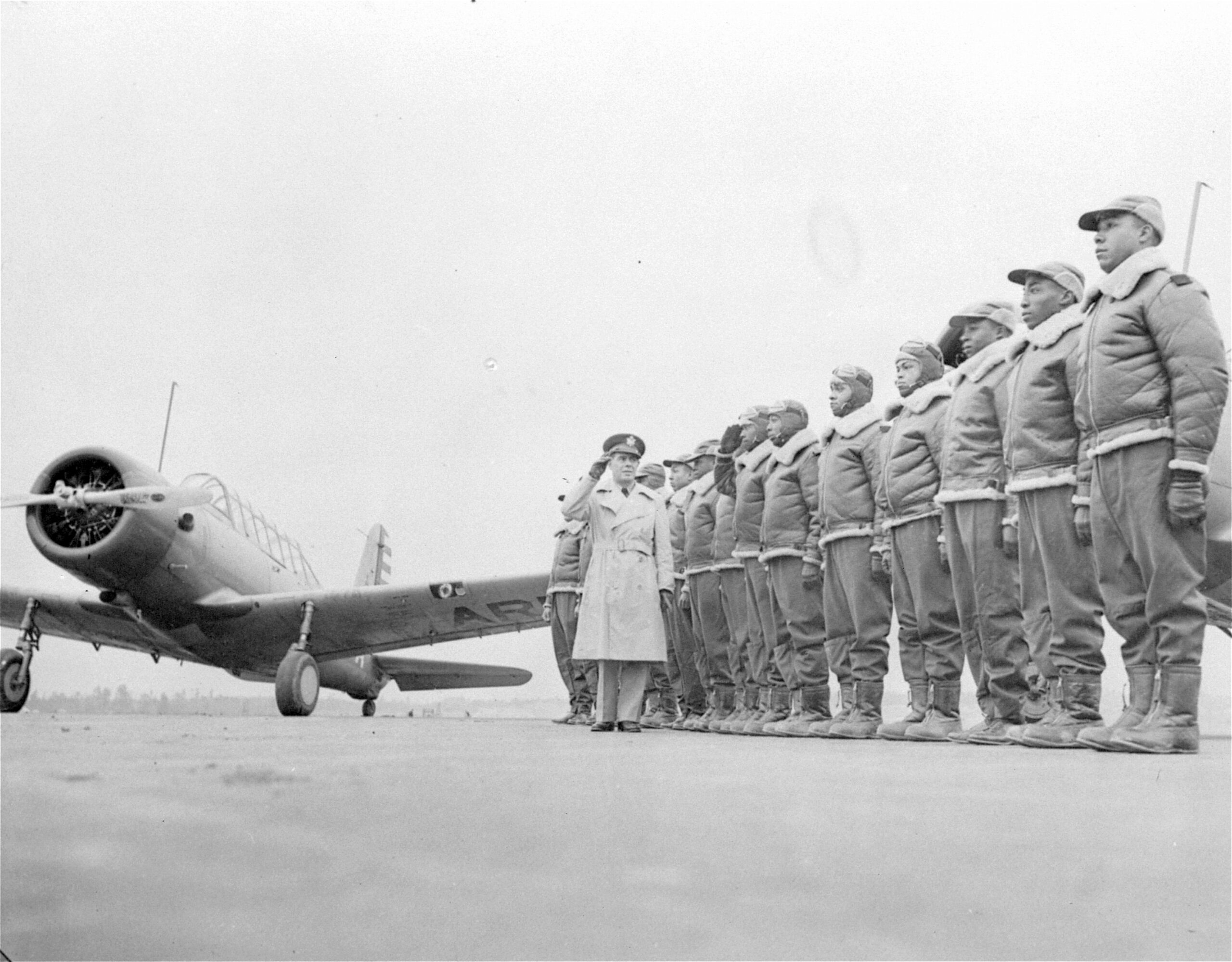 FILE - Major James A. Ellison, left, returns the salute of Mac Ross of Dayton, Ohio, as he inspects the cadets at the Basic and Advanced Flying School for Black United States Army Air Corps cadets at the Tuskegee Institute in Tuskegee, Ala., in Jan. 23, 1942. For Veterans Day, a group of Democratic lawmakers is reviving an effort to pay the families of Black servicemen who fought on behalf of the nation during World War II for benefits they were denied or prevented from taking full advantage of when they returned home from war. (AP Photo/U.S. Army Signal Corps, File)