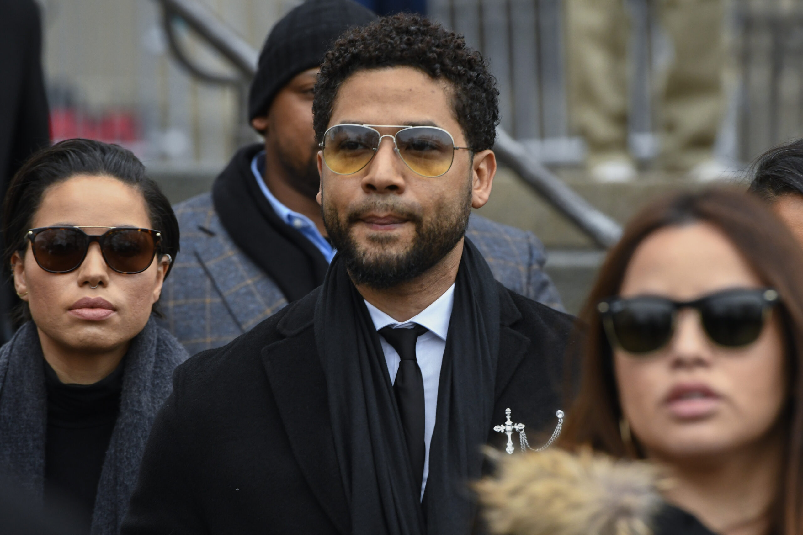FILE - Former "Empire" actor Jussie Smollett leaves the Leighton Criminal Courthouse in Chicago, Feb. 24, 2020. Smollett's trial will boil down to the question of whether the jury believes the actor's version of what he says was a racist and homophobic attack or that told by two brothers who say they helped the actor fake the attack. The trial starts with jury selection Monday, Nov. 29, 2021 and is expected to last a week. (AP Photo/Matt Marton, file)