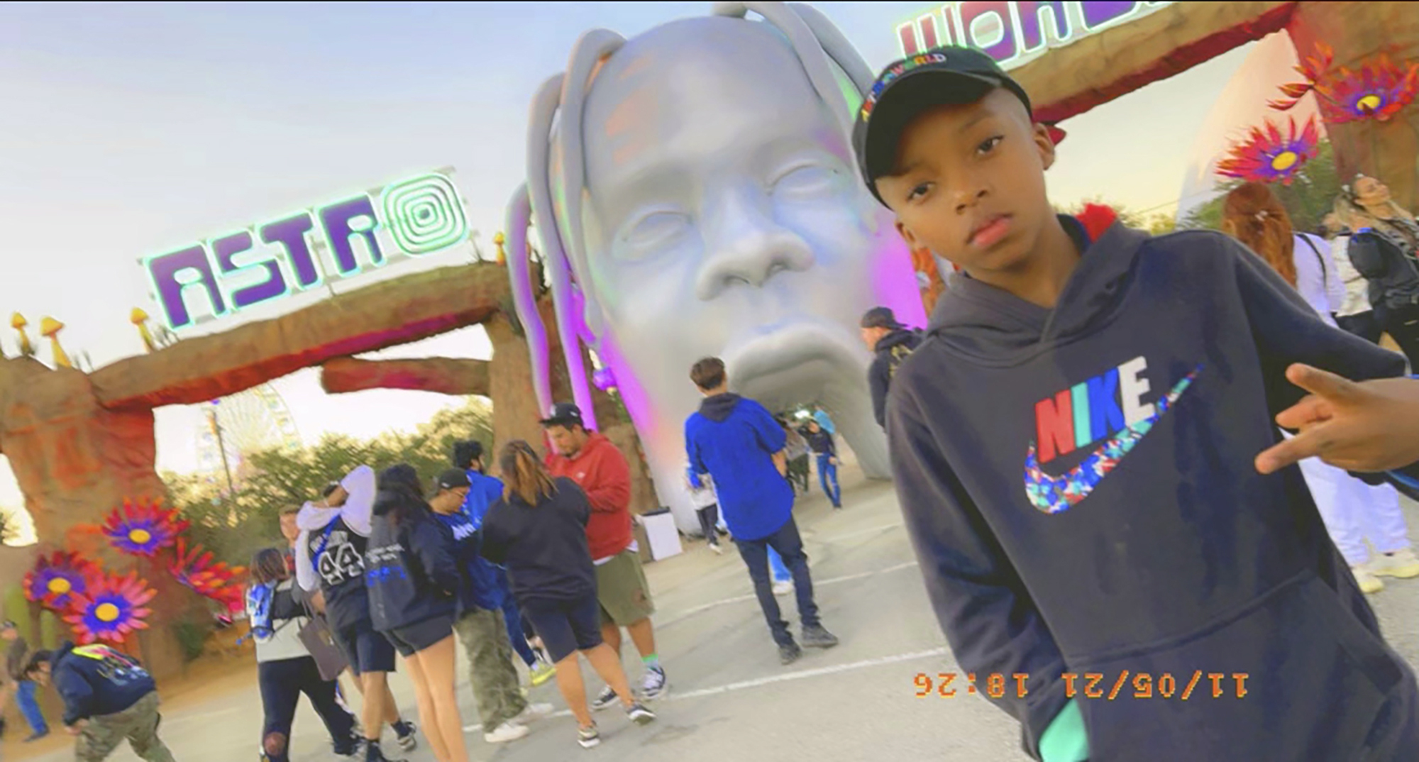 This photo provided by Taylor Blount shows Ezra Blount, 9, posing outside the Astroworld music festival in Houston on Nov. 5, 2021. Ezra has become the youngest person to die from injuries sustained during a crowd surge at the Astroworld music festival. Ezra, of Dallas, died Sunday, Nov. 14 at Texas Children’s Hospital in Houston, family attorney Ben Crump said. (Courtesy of Taylor Blount via AP)