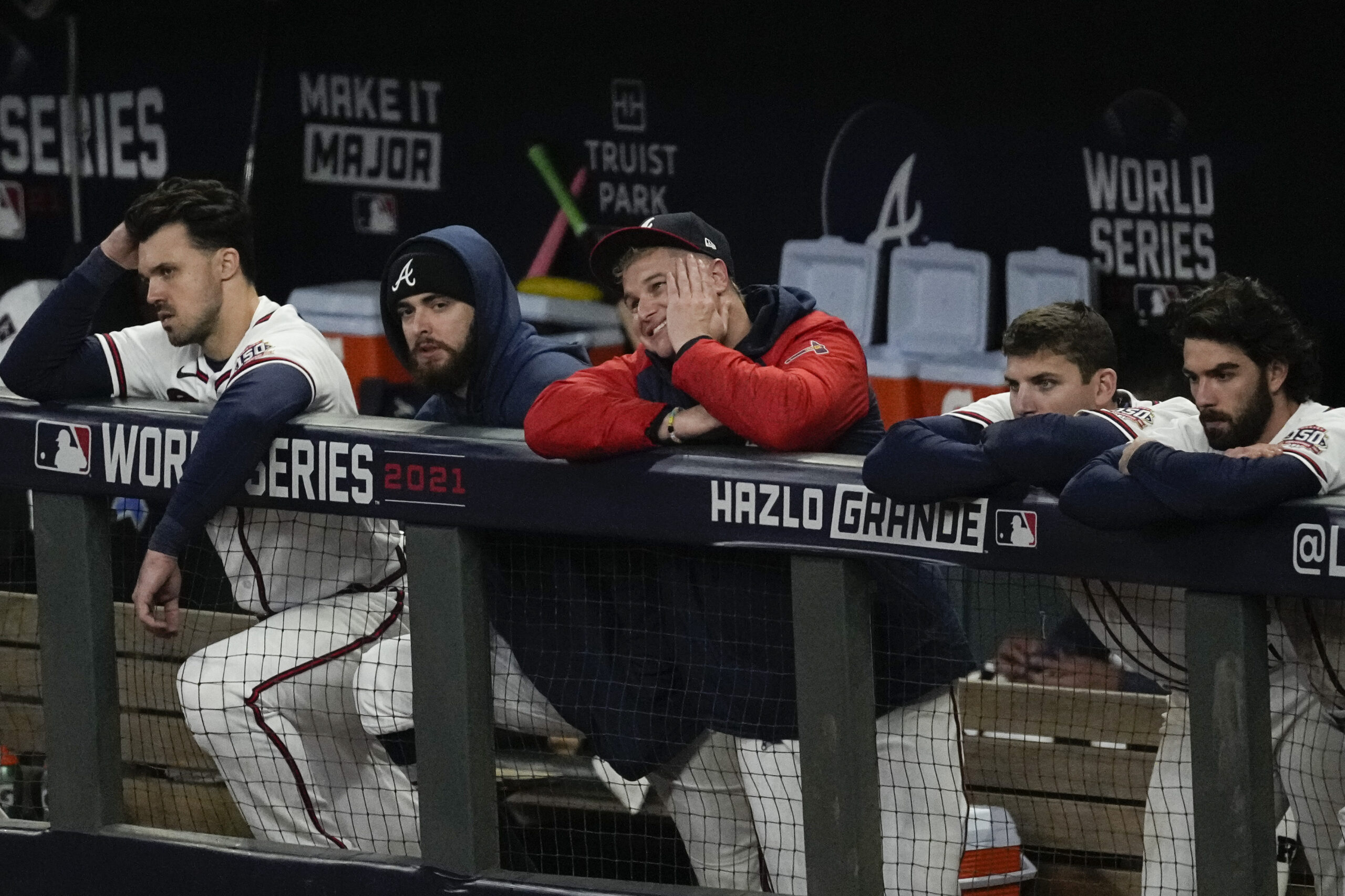 Members of the Atlanta Braves watch during the ninth inning in Game 5 of baseball's World Series between the Houston Astros and the Atlanta Braves Monday, Nov. 1, 2021, in Atlanta. The Astros won 9-5. The Braves lead the series 3-2 games. (AP Photo/Ashley Landis)