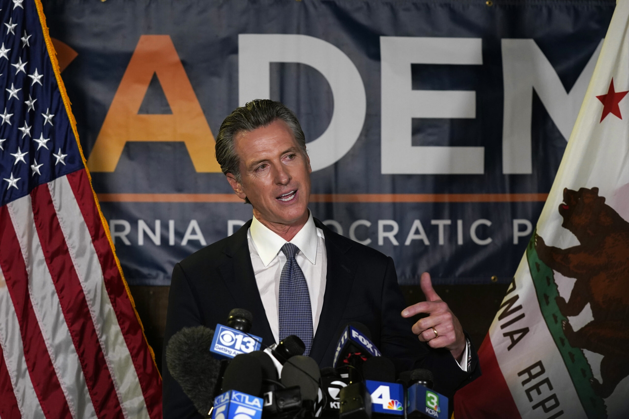 FILE - California Gov. Gavin Newsom addresses reporters after beating back the recall that aimed to remove him from office, at the John L. Burton California Democratic Party headquarters in Sacramento, Calif., Tuesday, Sept. 14, 2021. Newsom on Saturday, Dec. 11 pledged to empower private citizens to enforce a ban on the manufacture and sale assault weapons in the state, citing the same authority claimed by conservative lawmakers in Texas to outlaw most abortions once a heartbeat is detected. (AP Photo/Rich Pedroncelli, File)