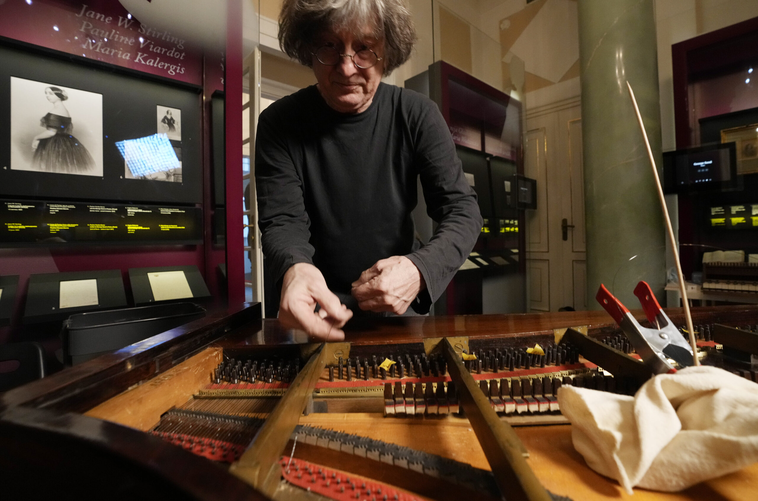 Texas-born expert on historic pianos, Paul McNulty, renovates the last piano that Frederic Chopin played and composed on, at the Chopin museum in Warsaw, Poland, on Thursday, Dec. 9, 2021. The 1848 Pleyel piano was offered to Chopin's family after his 1849 death by Scottish pianist Jane Stirling, and survived two world wars in Warsaw, but had modern strings put in in the mid-20th century, that destroyed the tone. McNulty aims at bringing it back to its original characteristics. (AP Photo/Czarek Sokolowski)