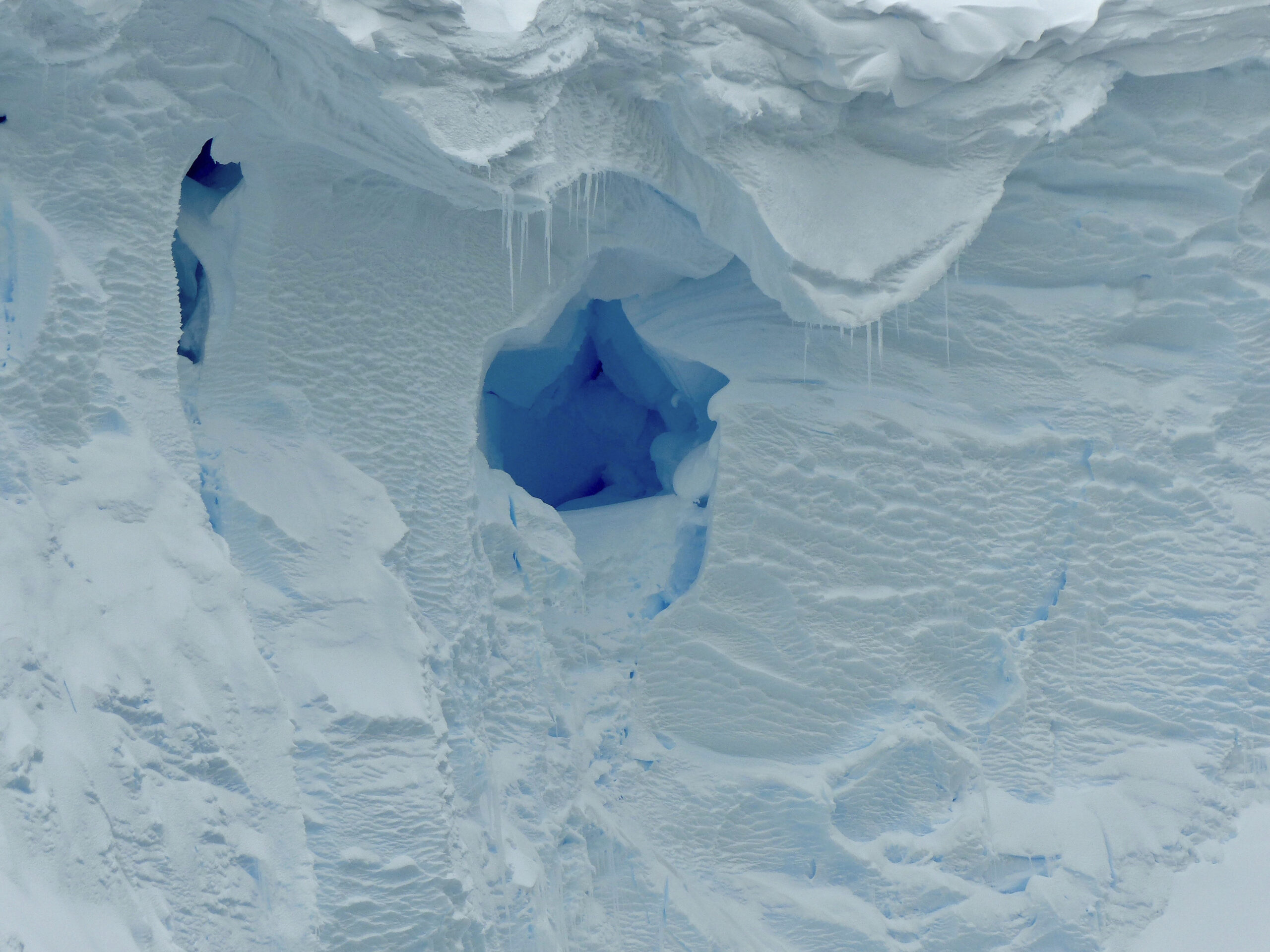 This 2019 photo provided by the British Antarctic Survey shows a hole in the Thwaites glacier in Antarctica. Starting Thursday, Jan. 6, 2021, a team of scientists are sailing to the massive but melting Thwaites glacier, “the place in the world that’s the hardest to get to,” so they can better figure out how much and how fast seas will rise because of global warming eating away at Antarctica’s ice. (David Vaughan/British Antarctic Survey via AP)