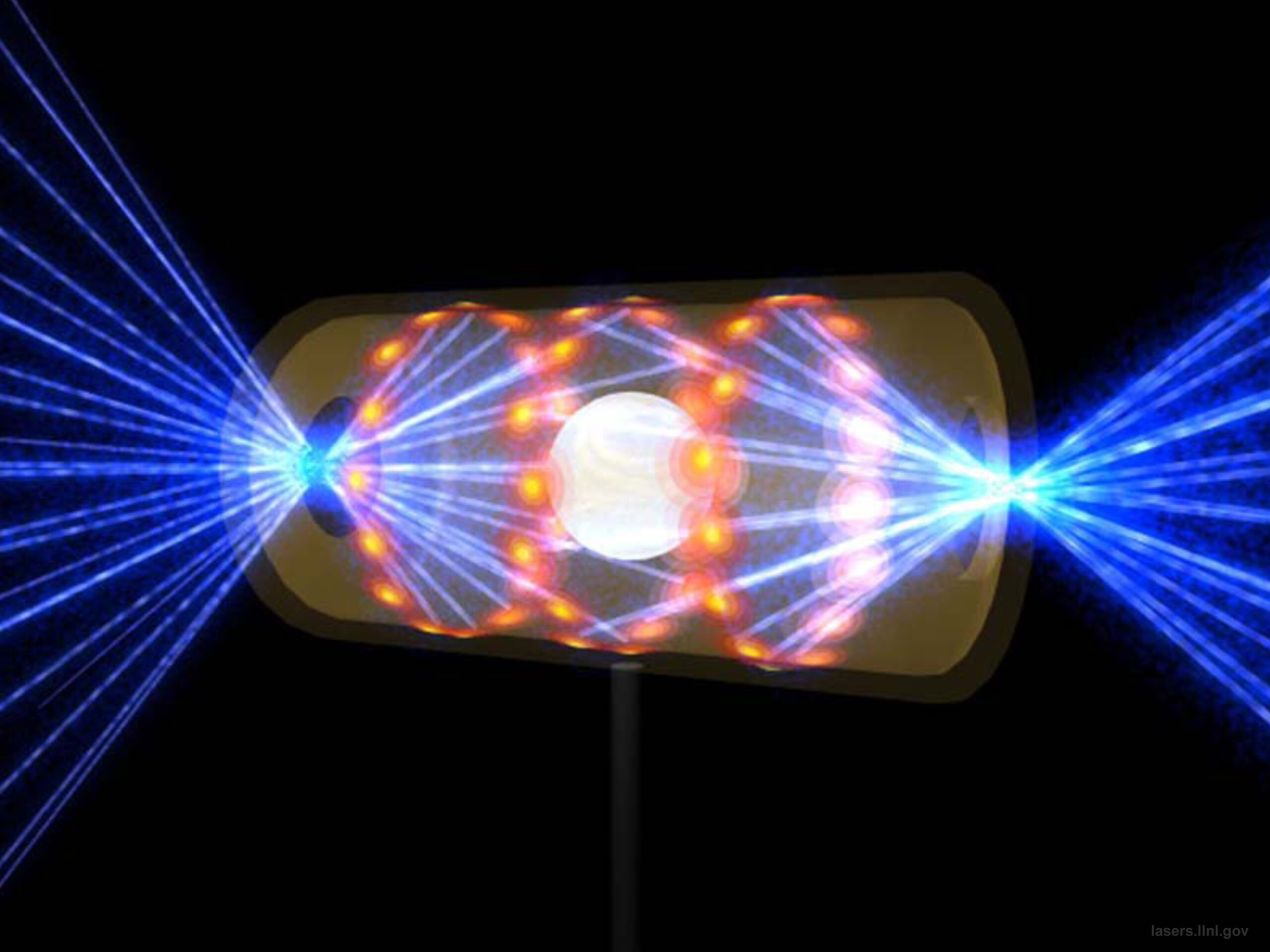 This illustration provided by the National Ignition Facility at the Lawrence Livermore National Laboratory depicts a target pellet inside a hohlraum capsule with laser beams entering through openings on either end. The beams compress and heat the target to the necessary conditions for nuclear fusion to occur. (Lawrence Livermore National Laboratory via AP)