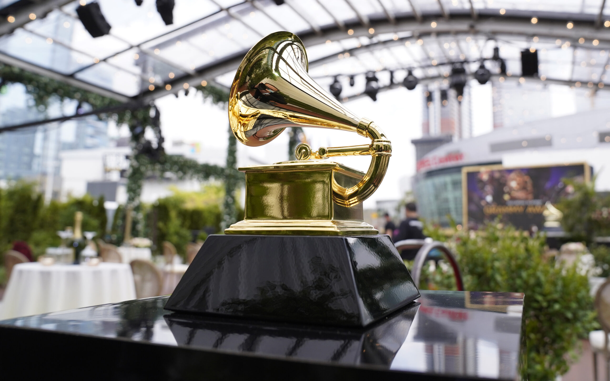 FILE - A decorative grammy is seen before the start of the 63rd annual Grammy Awards at the Los Angeles Convention Center on Sunday, March 14, 2021. The upcoming Grammy Awards have been postponed due to what organizers called "too many risks" due to the omicron variant. The ceremony had been scheduled for Jan. 31st in Los Angeles with a live audience and performances. (AP Photo/Chris Pizzello, File)