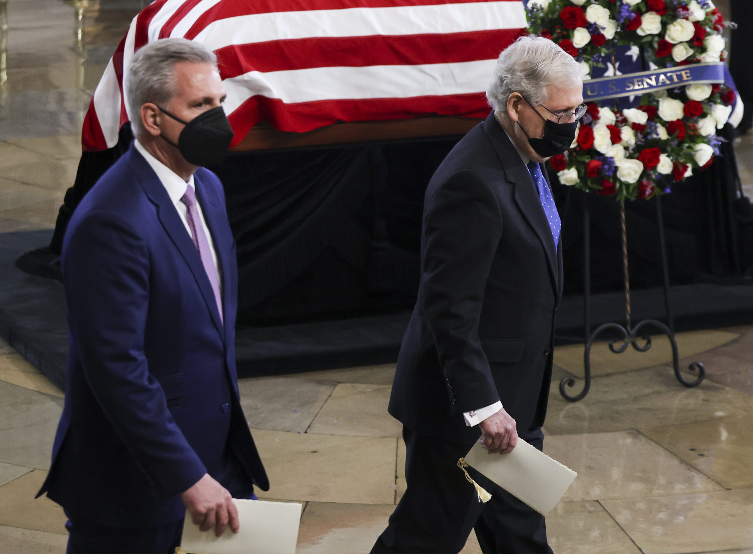 House Minority Leader Kevin McCarthy of Calif. and Senate Minority Leader Mitch McConnell of Ky., right, pay their respects to former Senate Majority Leader Harry Reid, D-Nev., during a memorial service in the Rotunda of the U.S. Capitol as Reid lies in state, Wednesday, Jan. 12, 2022, in Washington. (Evelyn Hockstein/Pool via AP)