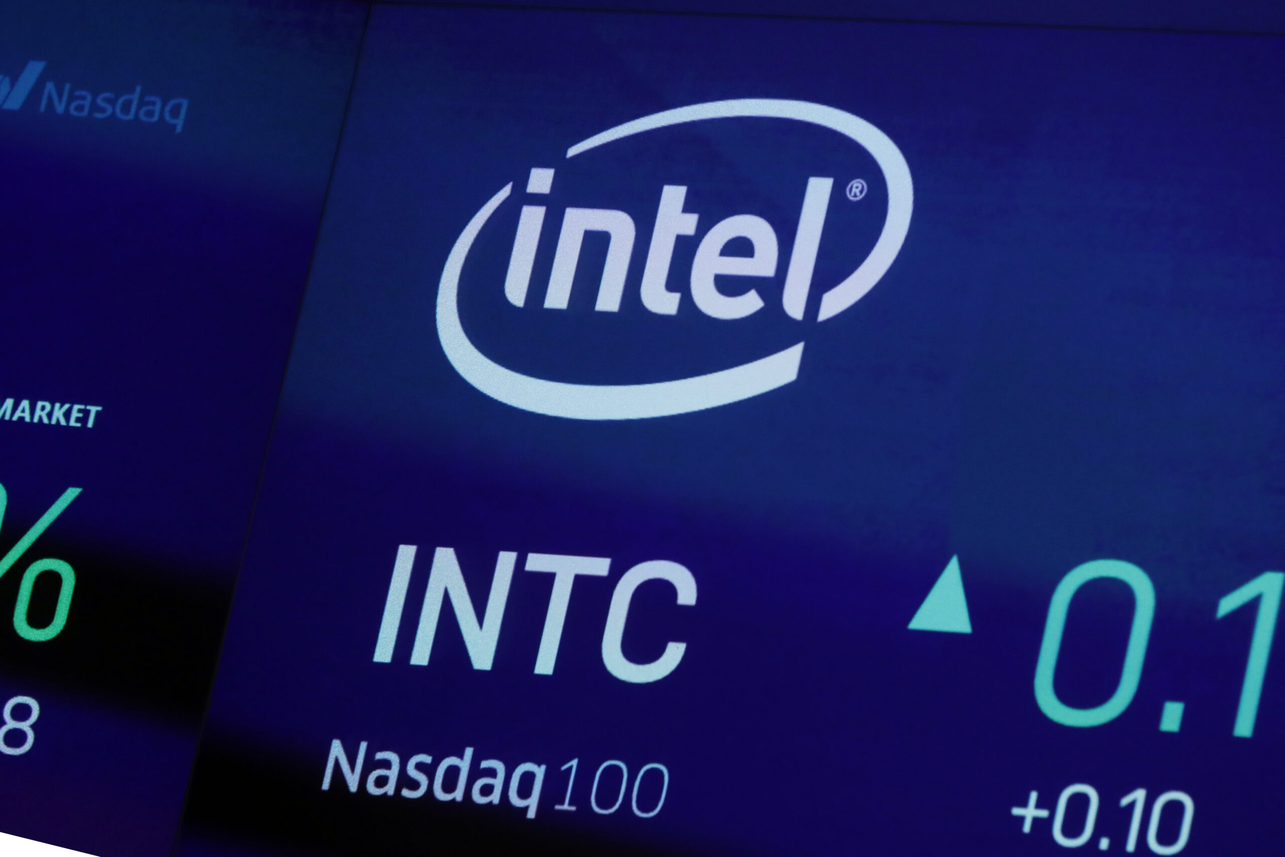 FILE - In this Oct. 1, 2019, file photo the symbol for Intel appears on a screen at the Nasdaq MarketSite, in New York. Intel Corp. is planning an initial investment of more than $20 billion for two semiconductor chip plants in central Ohio to help address a global shortage of semiconductor chips. The plants are expected to create 3,000 Intel jobs and 7,000 construction jobs over the course of the build, and to support tens of thousands of additional local long-term jobs across a broad ecosystem of suppliers and partners. (AP Photo/Richard Drew, File)