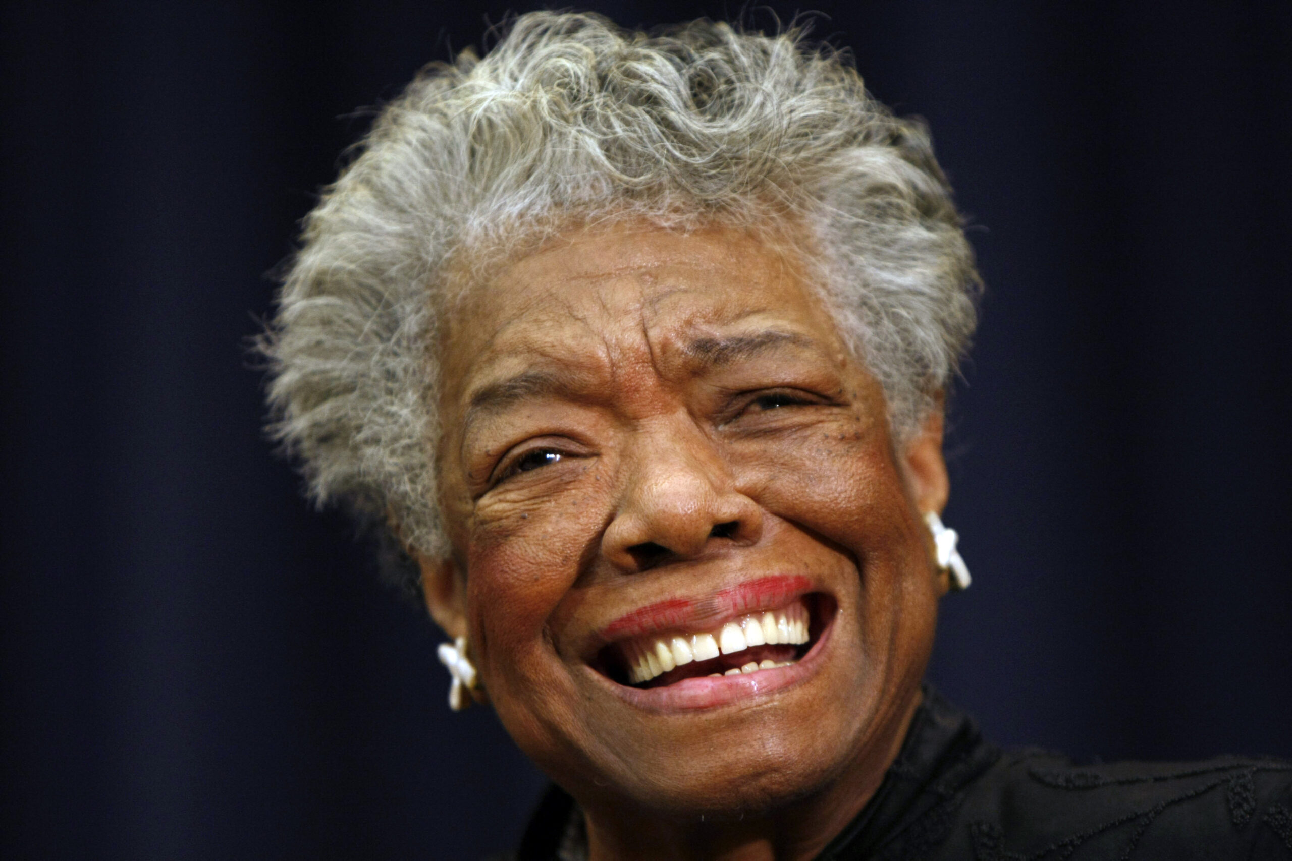 FILE - In this Nov. 21, 2008, file photo, poet Maya Angelou smiles at an event in Washington. On Monday, Jan. 10, 2022, the United States Mint said it has begun shipping quarters featuring the image of poet Maya Angelou, the first coins in its American Women Quarters Program. (AP Photo/Gerald Herbert, File)