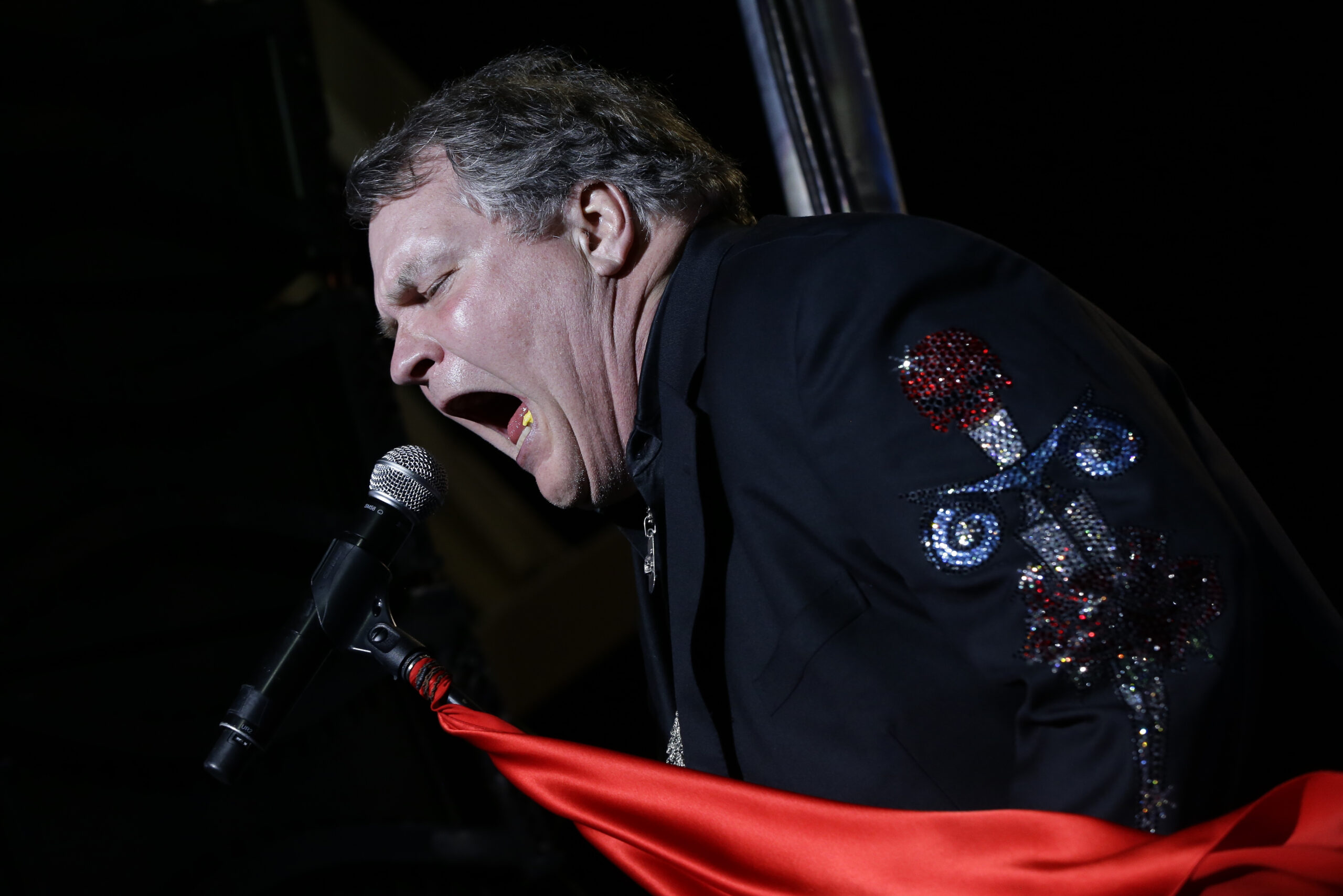FILE - Singer Meat Loaf performs in support of Republican presidential candidate and former Massachusetts Gov. Mitt Romney at the football stadium at Defiance High School in Defiance, Ohio, Thursday, Oct. 25, 2012. Meat Loaf, whose "Bat Out Of Hell" album is one of the all time bestsellers, has died, family said on Facebook, Friday, Jan. 21, 2022. (AP Photo/Charles Dharapak, File)