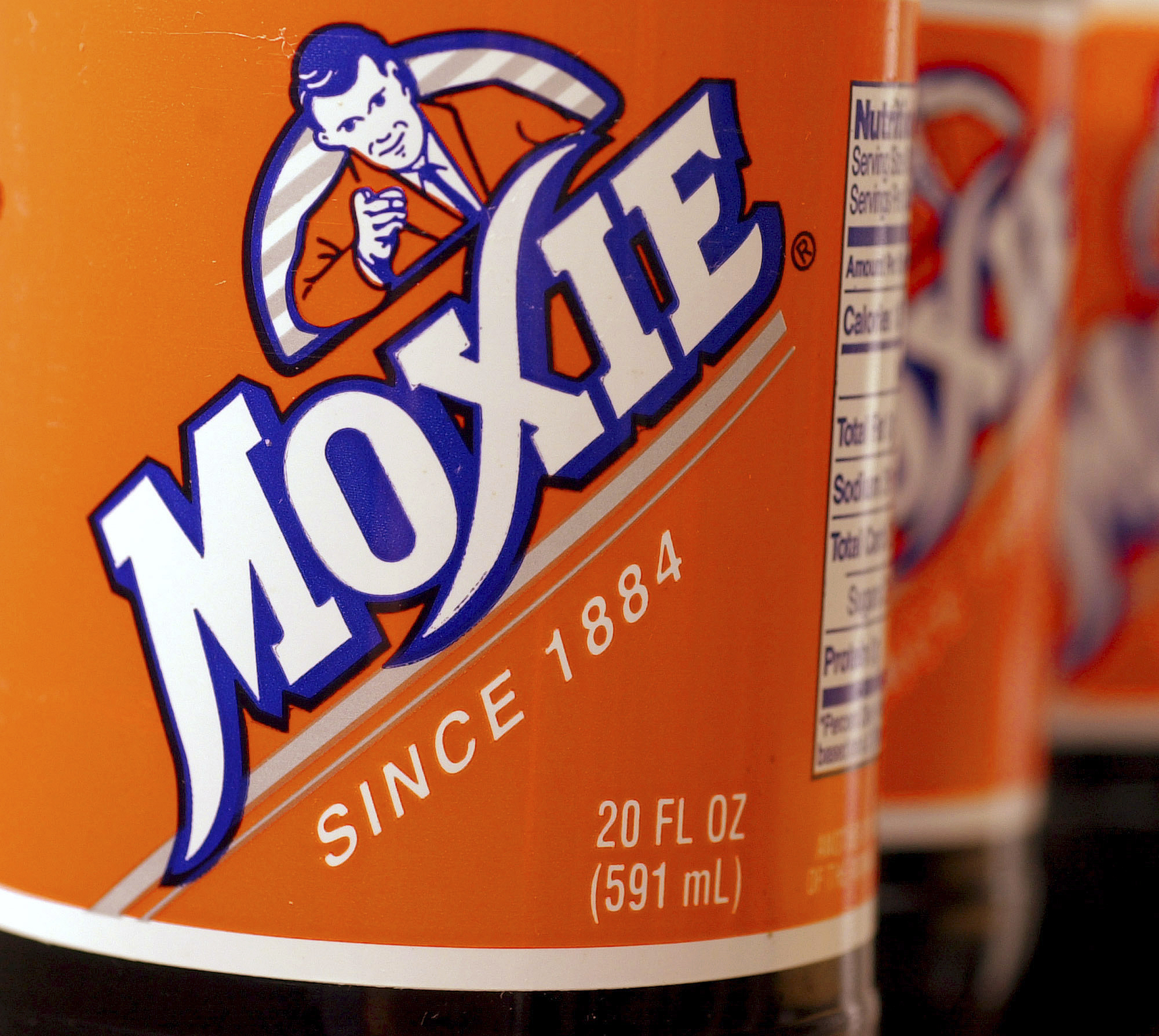 FILE — Bottles of the soft drink Moxie sit together, May 27, 2005, in West Bath, Maine. Moxie, a polarizing beverage that is the state's official soft drink, is in short supply because of supply chain woes, Tuesday, Feb. 8, 2022. The soda is beloved by thousands of Mainers and is the subject of a summer festival. (AP Photo/Pat Wellenbach, File)