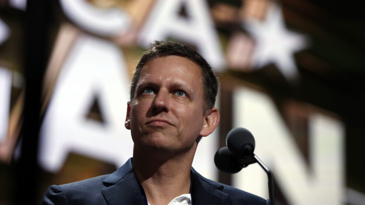FILE - Billionaire tech investor Peter Thiel looks over the podium before the start of the second day session of the Republican National Convention in Cleveland, Tuesday, July 19, 2016. Thiel, a Silicon Valley billionaire and advisor to former President Donald Trump, is leaving the board of directors of Facebook parent company Meta, the company announced Monday, Feb. 7, 2022. (AP Photo/Carolyn Kaster, File)
