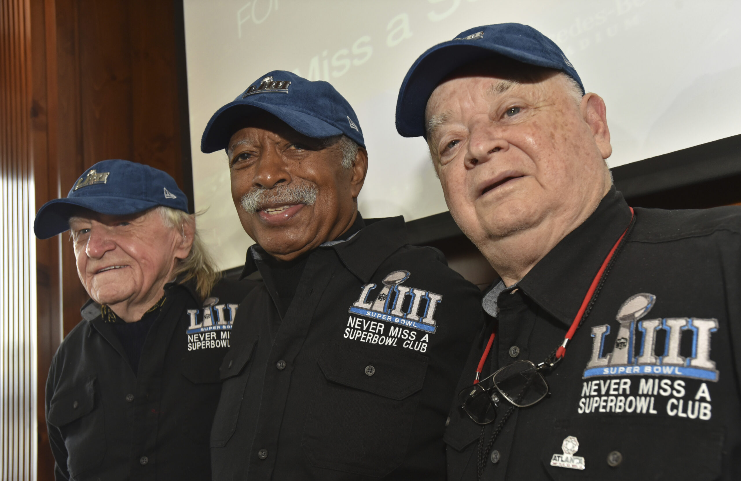 FILE — Members of the Never Miss a Super Bowl Club, from the left, Tom Henschel, Gregory Eaton, and Don Crisman pose for a group photograph during a welcome luncheon, in Atlanta, Friday, Feb. 1, 2019. The three men have attended every game since the first AFL-NFL World Championship held 55 years ago. They're meeting at the Super Bowl once again for this year's game, but future meetings are in question. (Hyosub Shin/Atlanta Journal-Constitution via AP, File)