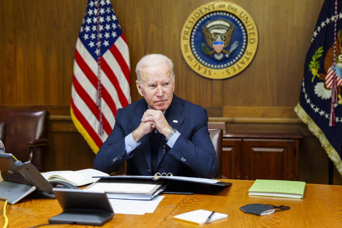 This image provided by The White House via Twitter shows President Joe Biden at Camp David, Md., Saturday, Feb. 12, 2022. Biden on Saturday again called on President Vladimir Putin to pull back more than 100,000 Russian troops massed near Ukraine’s borders and warned that the U.S. and its allies would “respond decisively and impose swift and severe costs” if Russia invades, according to the White House. (The White House via AP)
