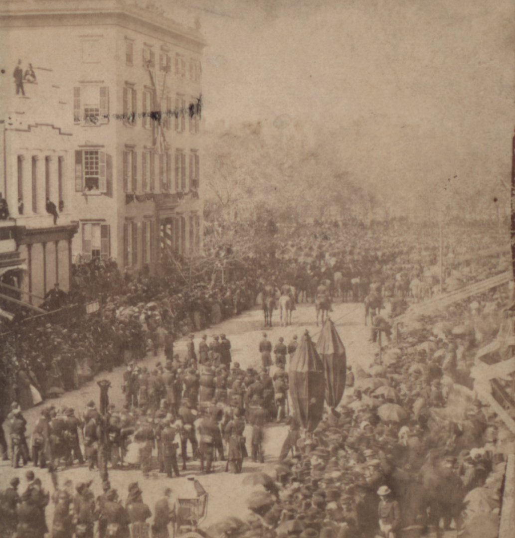 Theodore Roosevelt better known as Teddy was visible in a window in a picture or photo that was taken by a photographer at Abraham Lincoln's funeral procession in New York.