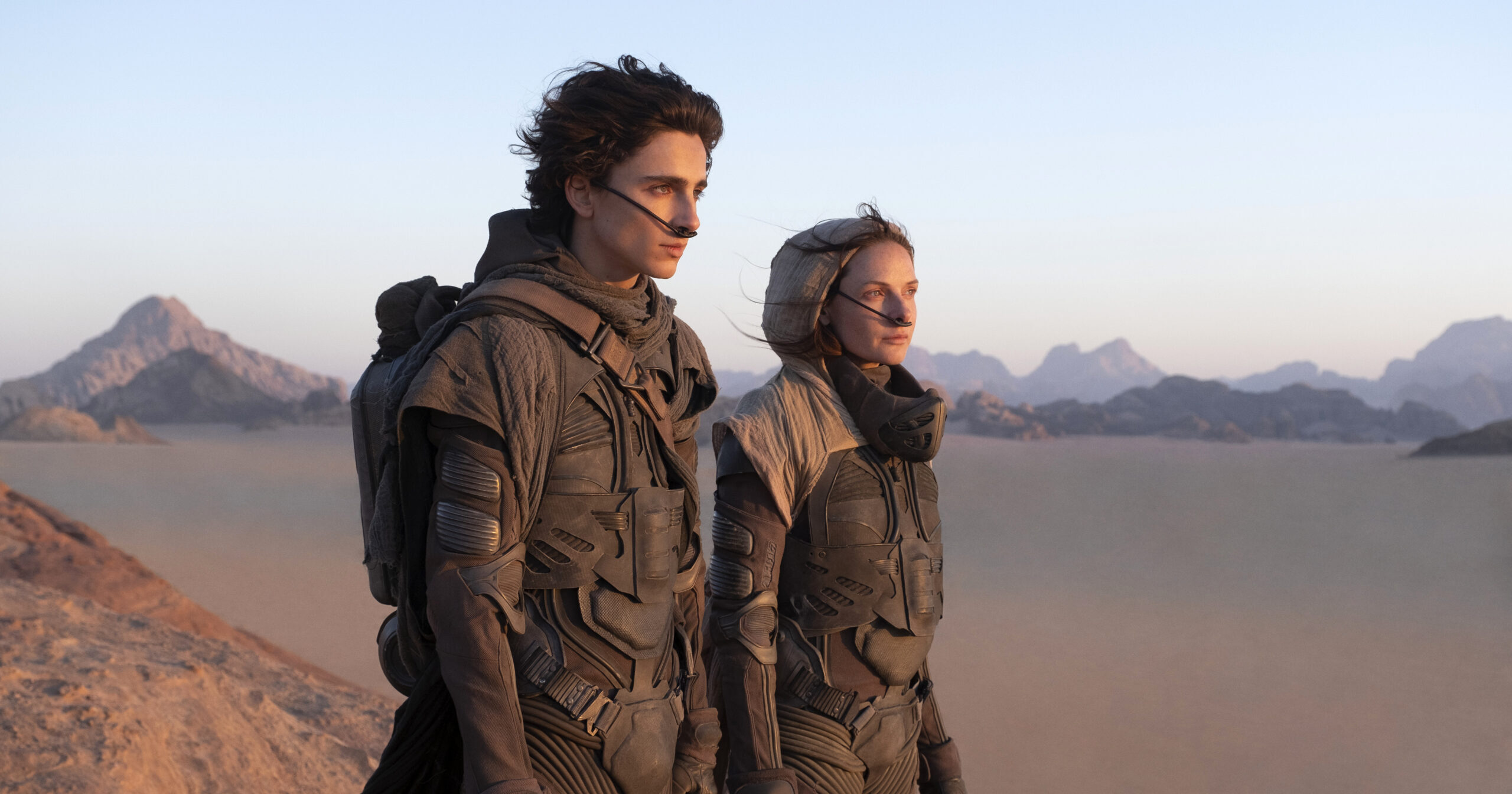 This image released by Warner Bros. Pictures shows Timothee Chalamet, left, and Rebecca Ferguson in a scene from "Dune." (Warner Bros. Pictures via AP)