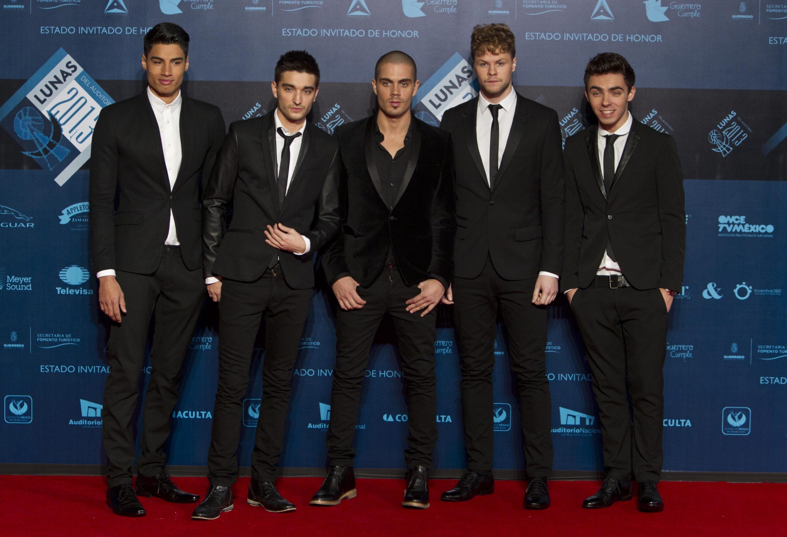 FILE - Pop band The Wanted pose on the red carpet before the Lunas del Auditorio award ceremony in Mexico City, Oct. 30, 2013. From right: Nathan Sykes, Jay McGuiness, Max George, Tom Parker and Siva Kaneswaran. Tom Parker, a member of British-Irish boy band The Wanted, has died after being diagnosed with an inoperable brain tumor. He was 33. The band announced that Parker died Wednesday, March 30, 2022, “surrounded by his family and his band mates.” (AP Photo/Christian Palma, file)