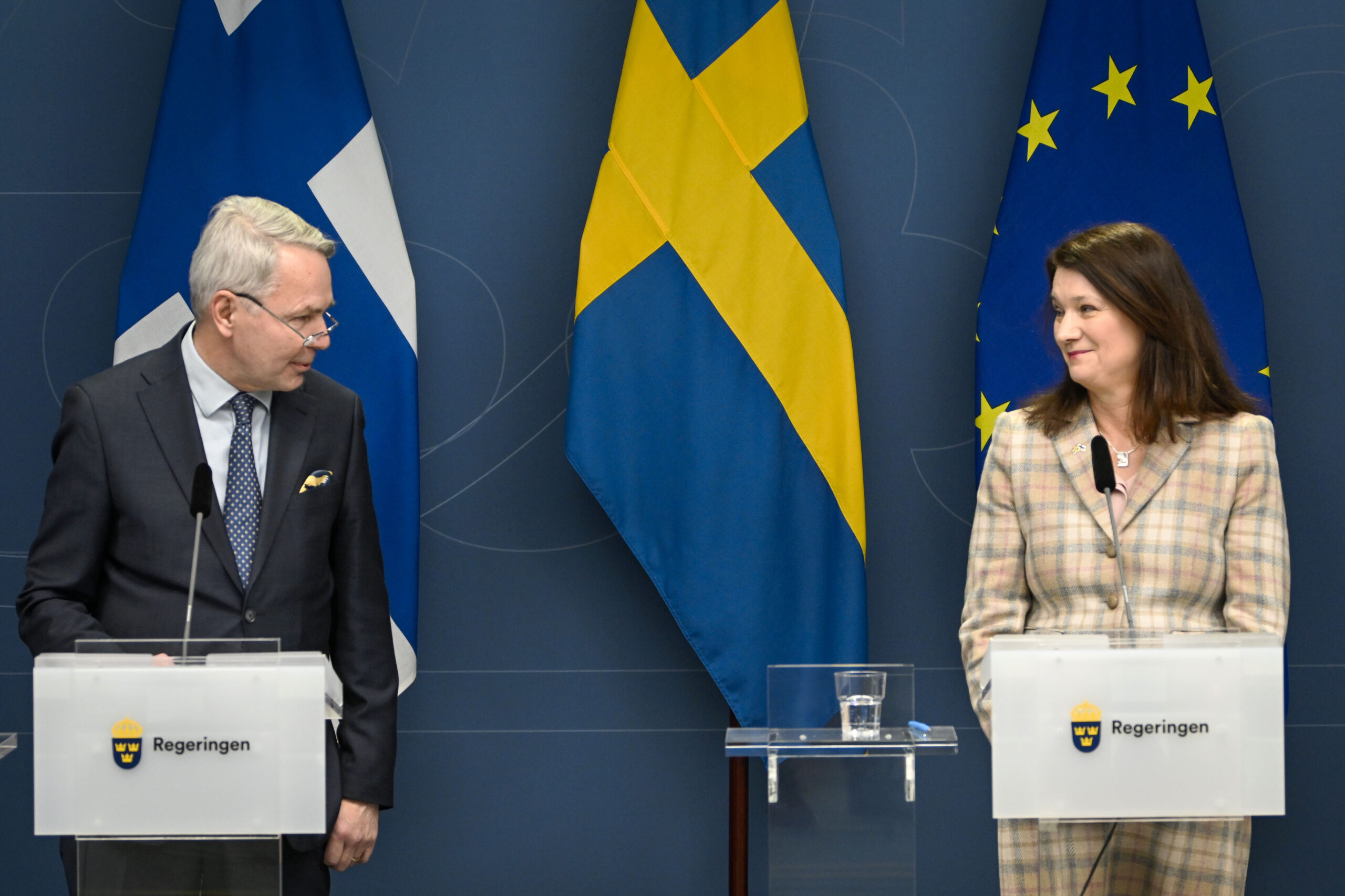 FILE - Finland's Minister for Foreign Affairs Pekka Haavisto, left and his Swedish counterpart Ann Linde take part in a joint press conference with Sweden's Defence Minister Peter Hultqvist, and his Finnish counterpart Antti Kaikkonen, in Stockholm, Sweden, Feb. 2, 2022, after talks on European security. Throughout the Cold War and in the decades since it ended, nothing could persuade Finns and Swedes that they would be better off joining NATO, until now. Russia’s invasion of Ukraine has profoundly changed Europe’s security outlook, including for Nordic neutrals Finland and Sweden, where support for joining NATO has surged to record levels. (Anders Wiklund, TT News Agency via AP, File)