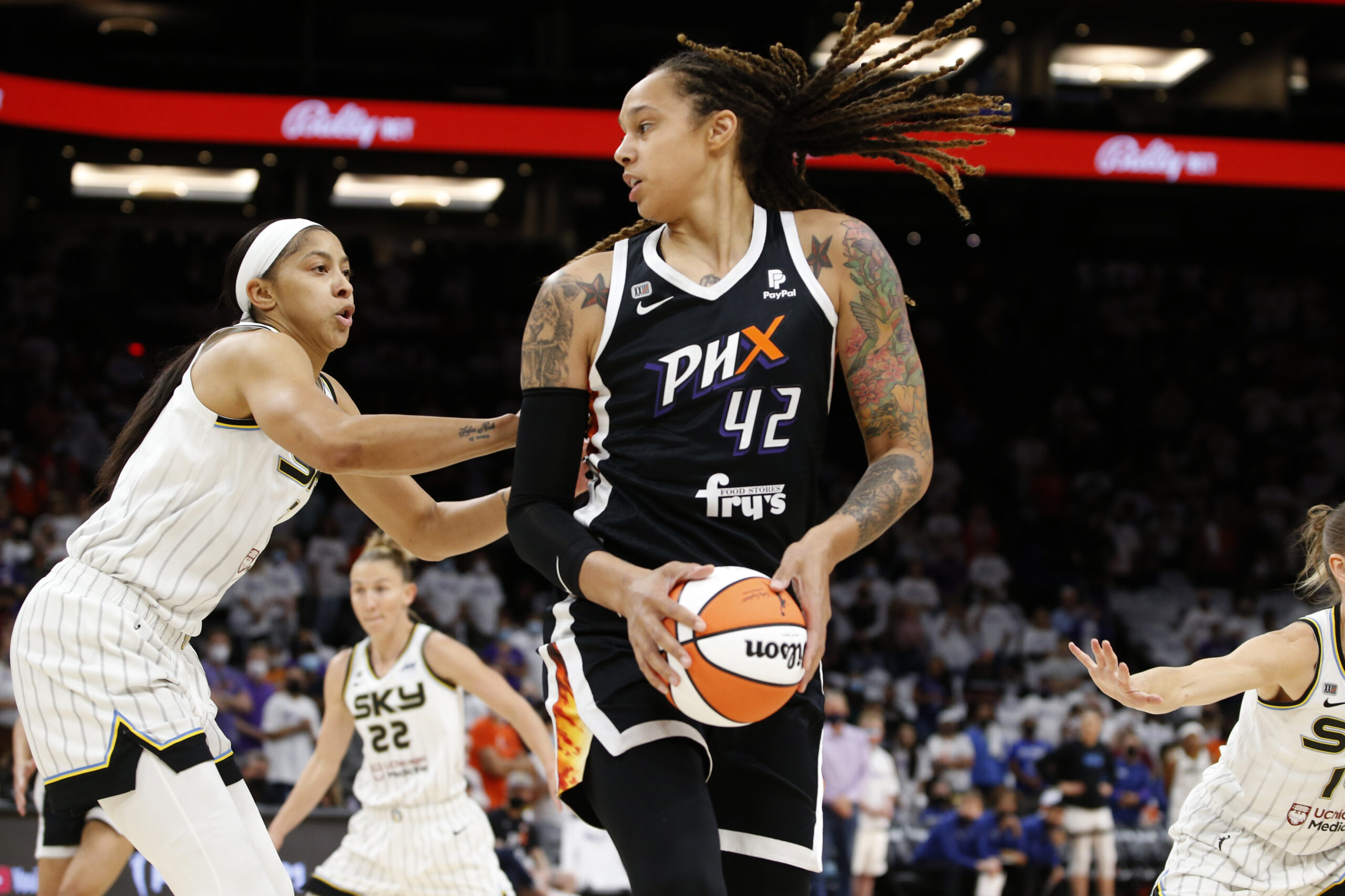FILE - Phoenix Mercury center Brittney Griner (42) looks to pass as Chicago Sky center Candace Parker defends during the first half of game 1 of the WNBA basketball Finals , Sunday, Oct. 10, 2021, in Phoenix. Griner was arrested in Russia last month at a Moscow airport after a search of her luggage revealed vape cartridges. The Russian Customs Service said Saturday, March 5, 2022, that the cartridges were identified as containing oil derived from cannabis, which could carry a maximum penalty of 10 years in prison. The customs service identified the person arrested as a female player for the U.S. national team and did not specify the date of her arrest. (AP Photo/Ralph Freso, File)