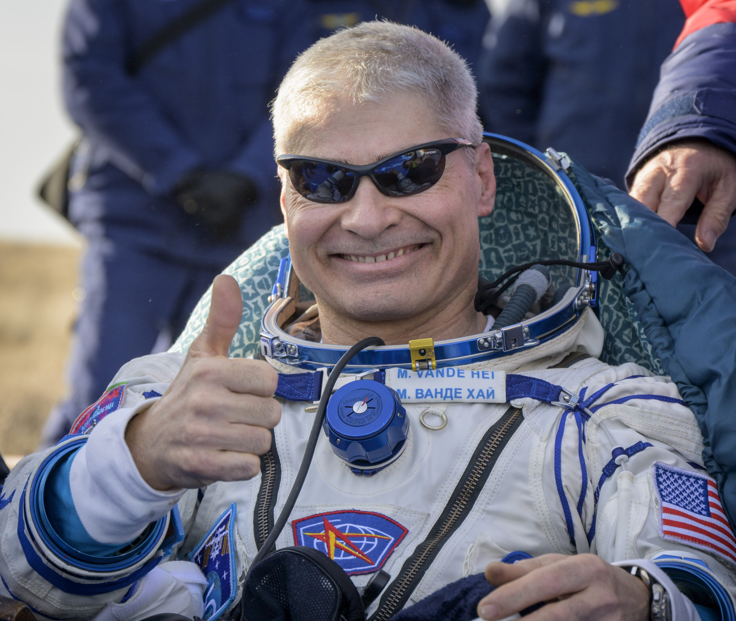 NASA astronaut Mark Vande Hei gives the thumbs up outside the Soyuz MS-19 spacecraft after he landed with Russian cosmonauts Anton Shkaplerov and Pyotr Dubrov in a remote area near the town of Zhezkazgan, Kazakhstan on Wednesday, March 30, 2022. Vande Hei and Dubrov are returning to Earth after logging 355 days in space as members of Expeditions 64-66 aboard the International Space Station. (Bill Ingall/NASA via AP)
