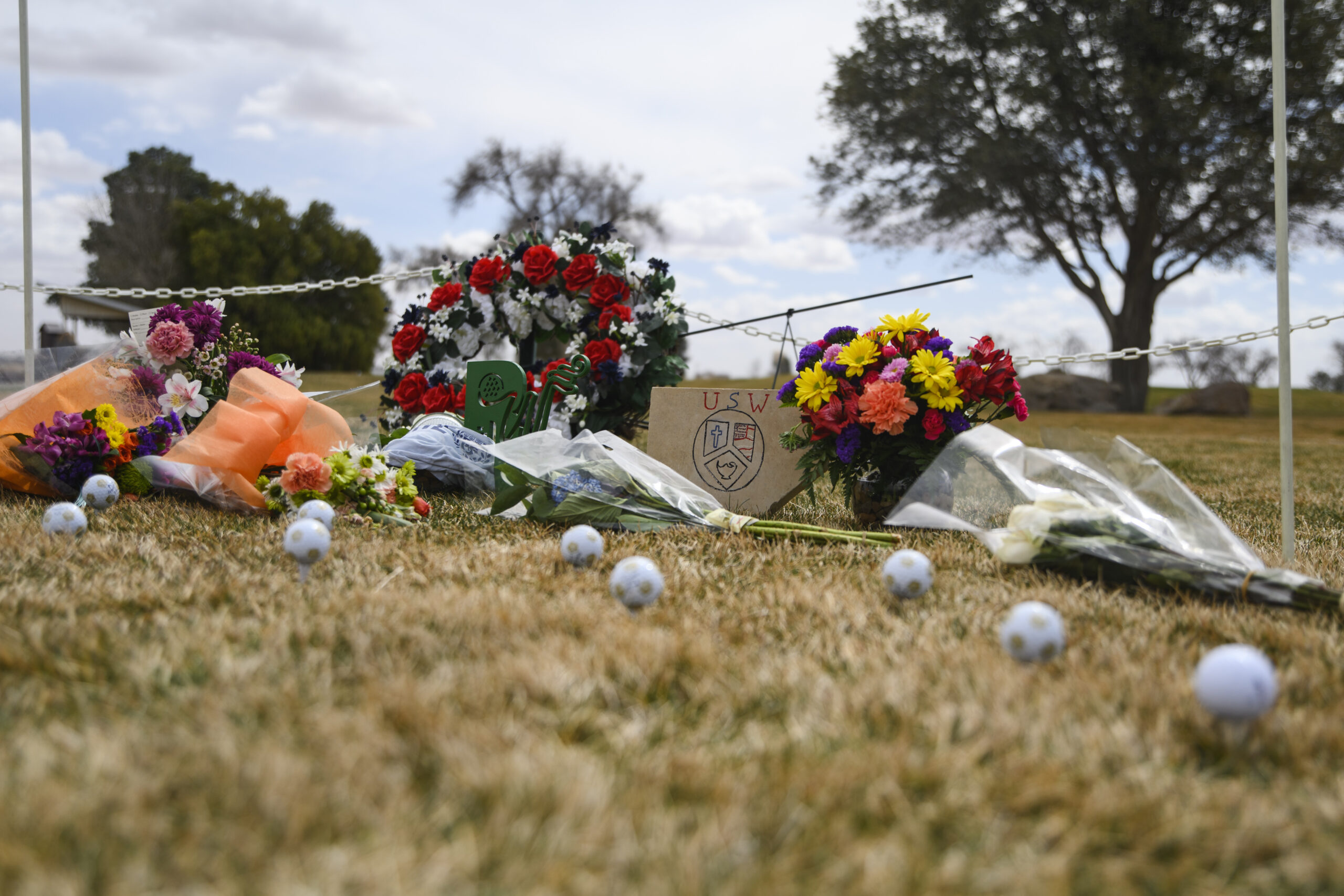 A memorial erected in honor of the University of the Southwest golf teams car wreck is seen Thursday, March 17, 2022 at the Rockwind Community Links in Hobbs, N.M. Late Tuesday, the University of the Southwest men's and women's golf teams were involved in a fatal car crash half a mile north of State Highway 115 on Farm-to-Market Road 1788 in Andrews County while on the way back from tournament play in Midland. Nine people were killed in the wreck including six students, one coach, and two in a pickup that collided head-on with the university's van. (Eli Hartman/Odessa American via AP)