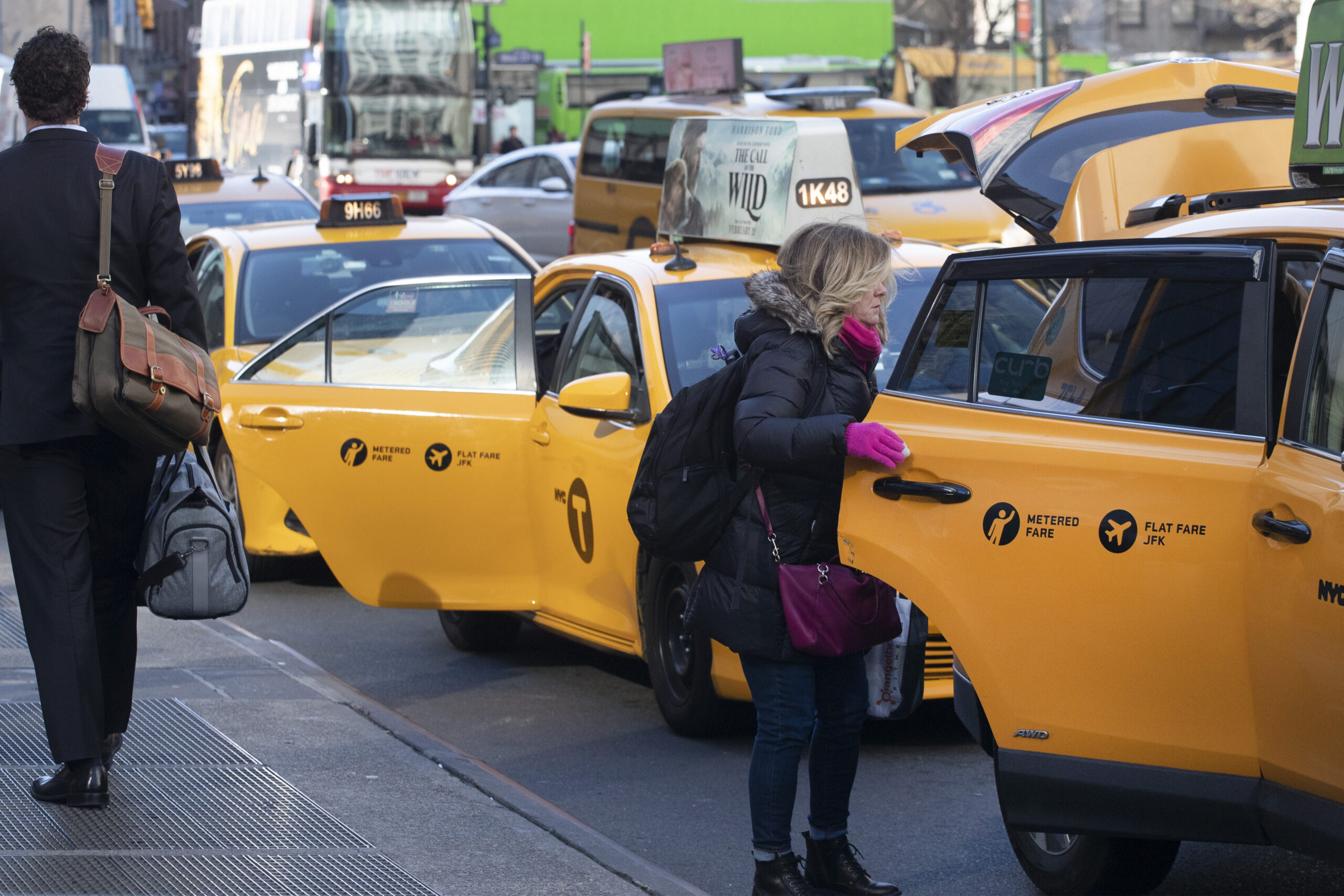 FILE - A passenger gets into a taxi, Wednesday, Jan. 29, 2020, in New York. Uber has reached a deal to include New York City taxi cabs on its app, Thursday, March 24, 2022, a move that will help to boost driver availability for passengers and open up a new set of customers for cab drivers. (AP Photo/Mark Lennihan, File)