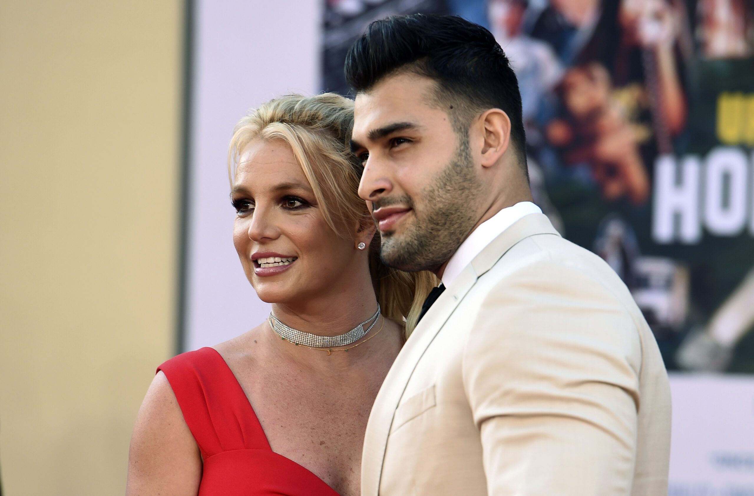 FILE - Britney Spears and Sam Asghari arrive at the Los Angeles premiere of "Once Upon a Time in Hollywood," at the TCL Chinese Theatre, Monday, July 22, 2019. Spears, less than five months after her conservatorship ended, confused some fans Monday, April 11, 2022, when she posted on Instagram that she's pregnant, and apparently married. (Photo by Jordan Strauss/Invision/AP, File)
