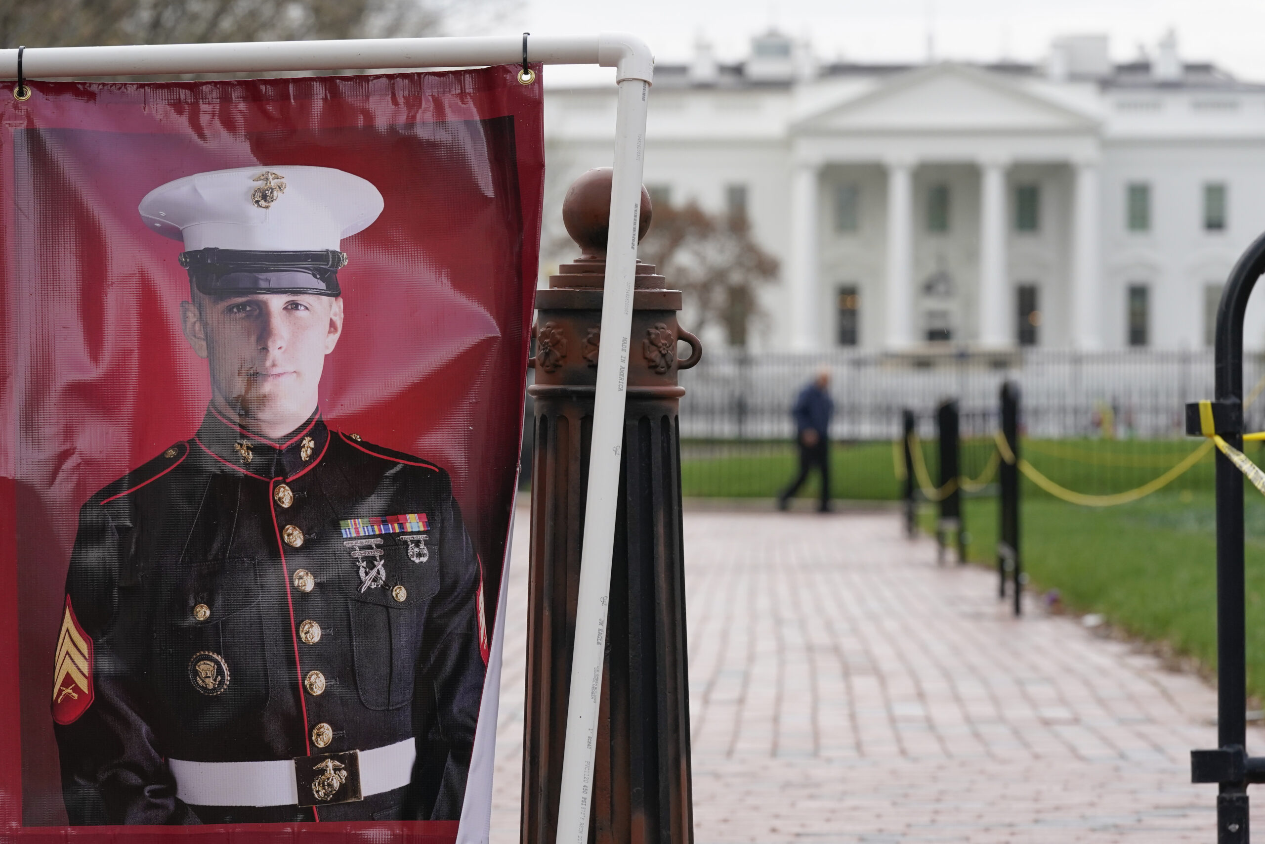 FILE - A poster photo of U.S. Marine Corps veteran and Russian prisoner Trevor Reed stands in Lafayette Park near the White House, March 30, 2022, in Washington. (AP Photo/Patrick Semansky, File)