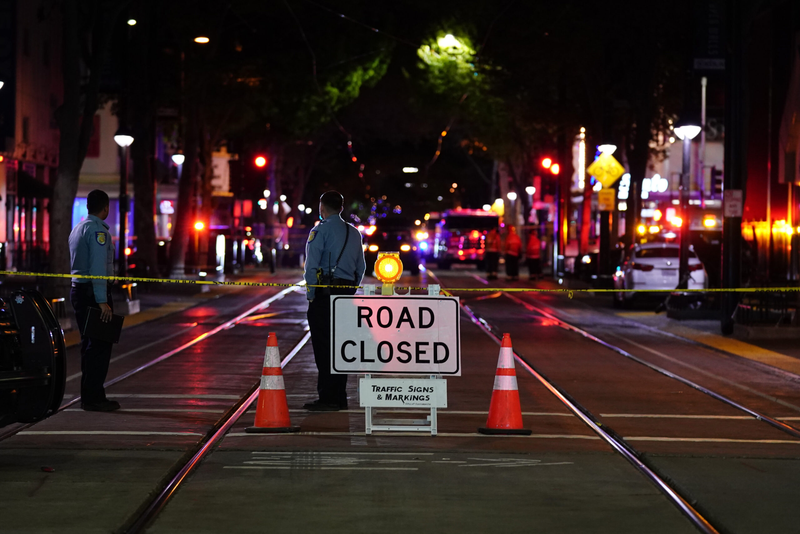 A roadblock is set a block away from the scene of an apparent mass shooting in Sacramento, Calif., Sunday, April 3, 2022. (AP Photo/Rich Pedroncelli)