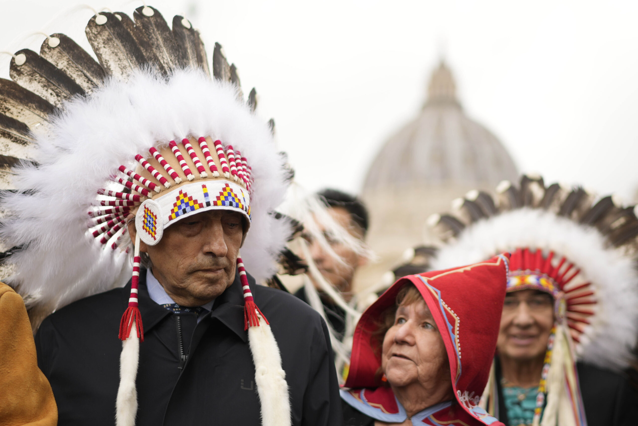 Former national chief of the Assembly of First Nations, Phil Fontaine, left, stands outside St. Peter's Square at the end of a meeting with Pope Francis at the Vatican, Thursday, March 31, 2022. (AP Photo/Andrew Medichini)