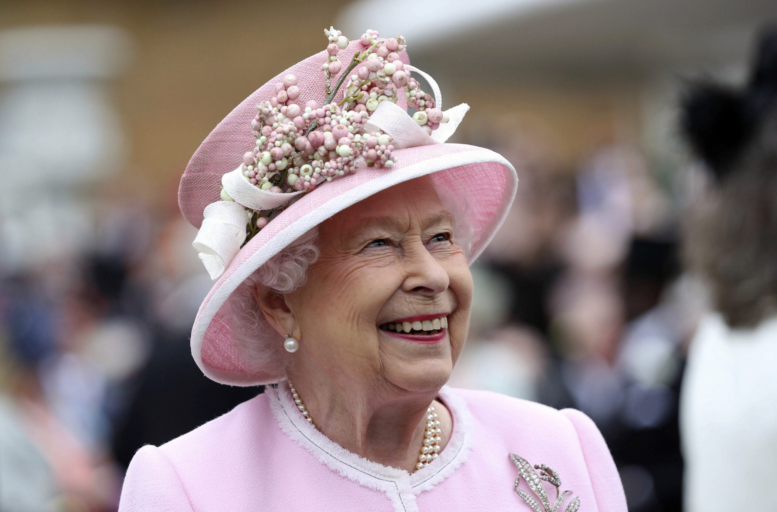 FILE - Britain's Queen Elizabeth arrives for a Royal Garden Party at Buckingham Palace in London, Wednesday, May 29, 2019. Queen Elizabeth II will miss the traditional royal garden party season, where she would normally meet with hundreds of people on the grounds of her residences in London and Edinburgh. The 96-year-old monarch will be represented instead by other members of her family, Buckingham Palace said in a statement. Before the pandemic, the queen invited over 30,000 people each year to the gardens of Buckingham Palace or the Palace of Holyroodhouse in Edinburgh. (Yui Mok/Pool Photo via AP, File)