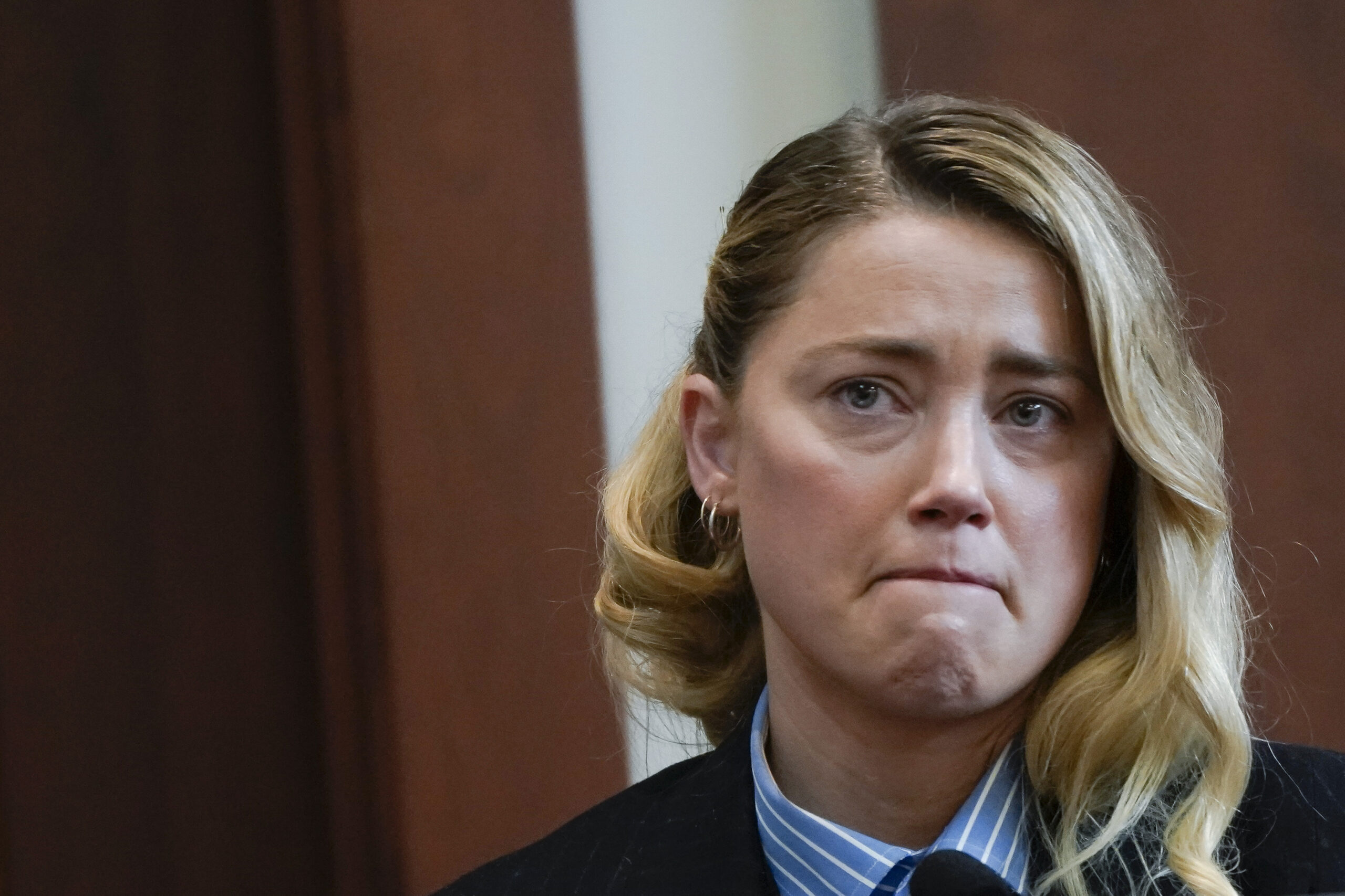 Actor Amber Heard testifies in the courtroom at the Fairfax County Circuit Court in Fairfax, Va., Wednesday May 4, 2022. Actor Johnny Depp sued his ex-wife Heard for libel in Fairfax County Circuit Court after she wrote an op-ed piece in The Washington Post in 2018 referring to herself as a "public figure representing domestic abuse." (Elizabeth Frantz/Pool Photo via AP)