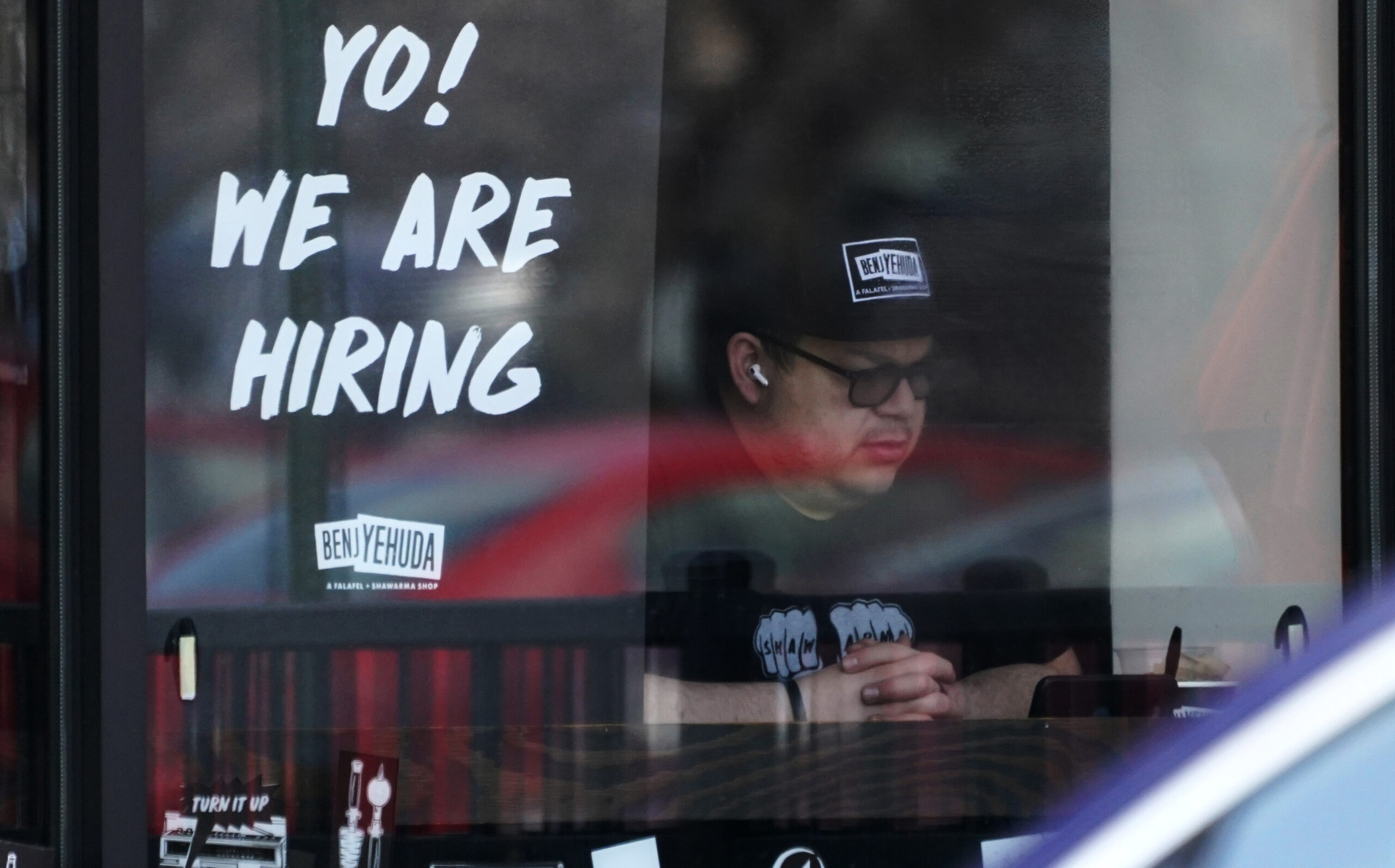 A hiring sign is displayed at a restaurant in Schaumburg, Ill., April 1, 2022. Employers posted a record 11.5 million job openings in March, more evidence of a tight labor market that has emboldened millions of American workers to leave their jobs and contributed to the biggest surge in inflation in four decades. A record 4.5 million Americans quit their jobs in February — a sign that they are confident they can find better pay or working conditions elsewhere. (AP Photo/Nam Y. Huh)
