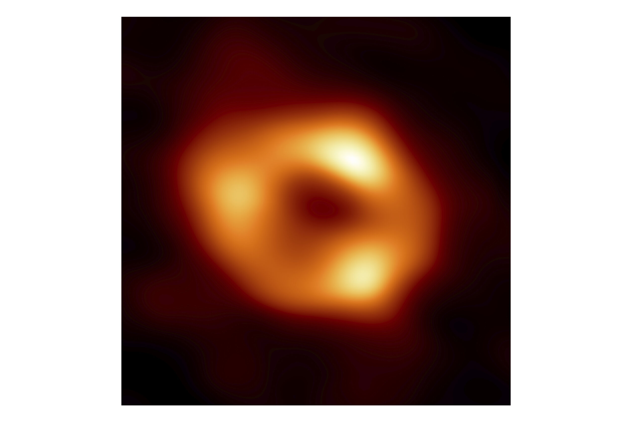 This image released by the Event Horizon Telescope Collaboration, Thursday, May 12, 2022, shows a black hole at the center of our Milky Way galaxy. The Milky Way black hole is called Sagittarius A*, near the border of Sagittarius and Scorpius constellations. It is 4 million times more massive than our sun. The image was made by eight synchronized radio telescopes around the world. (Event Horizon Telescope Collaboration via AP)
