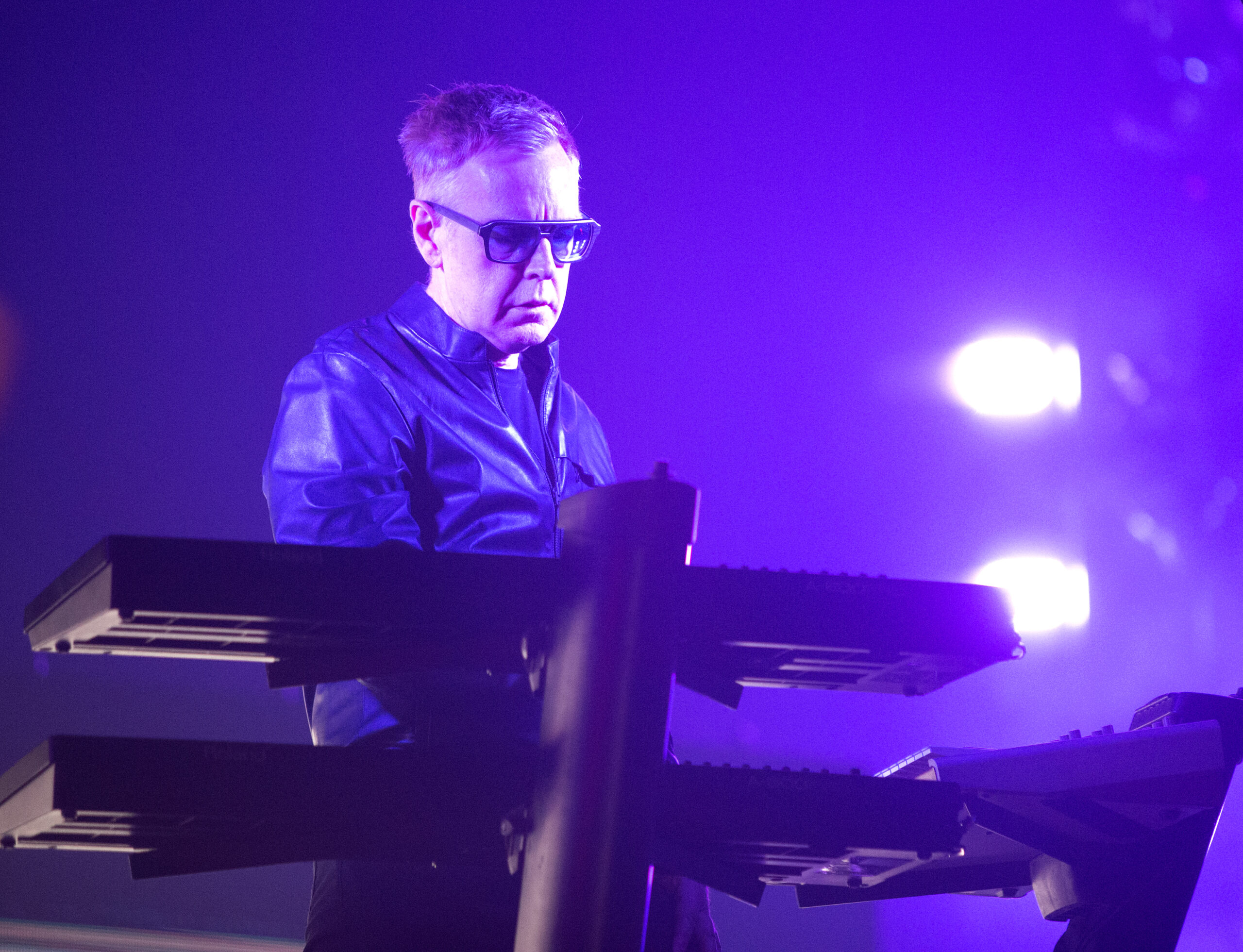 FILE - Andy Fletcher of the band Depeche Mode performs in concert during their "Global Spirit Tour" at the Capital One Arena, Sept. 7, 2017, in Washington, D.C. Fletcher, keyboardist for British synth pop giants Depeche Mode for more than 40 years has died at age 60. Depeche Mode announced the death of founding member Fletcher on its official social media pages. A person close to the band said Fletcher died Thursday, May 26, 2022, from natural causes at his home in the U.K. The person spoke on condition of anonymity because they were not authorized to speak publicly. (Photo by Owen Sweeney/Invision/AP, File)