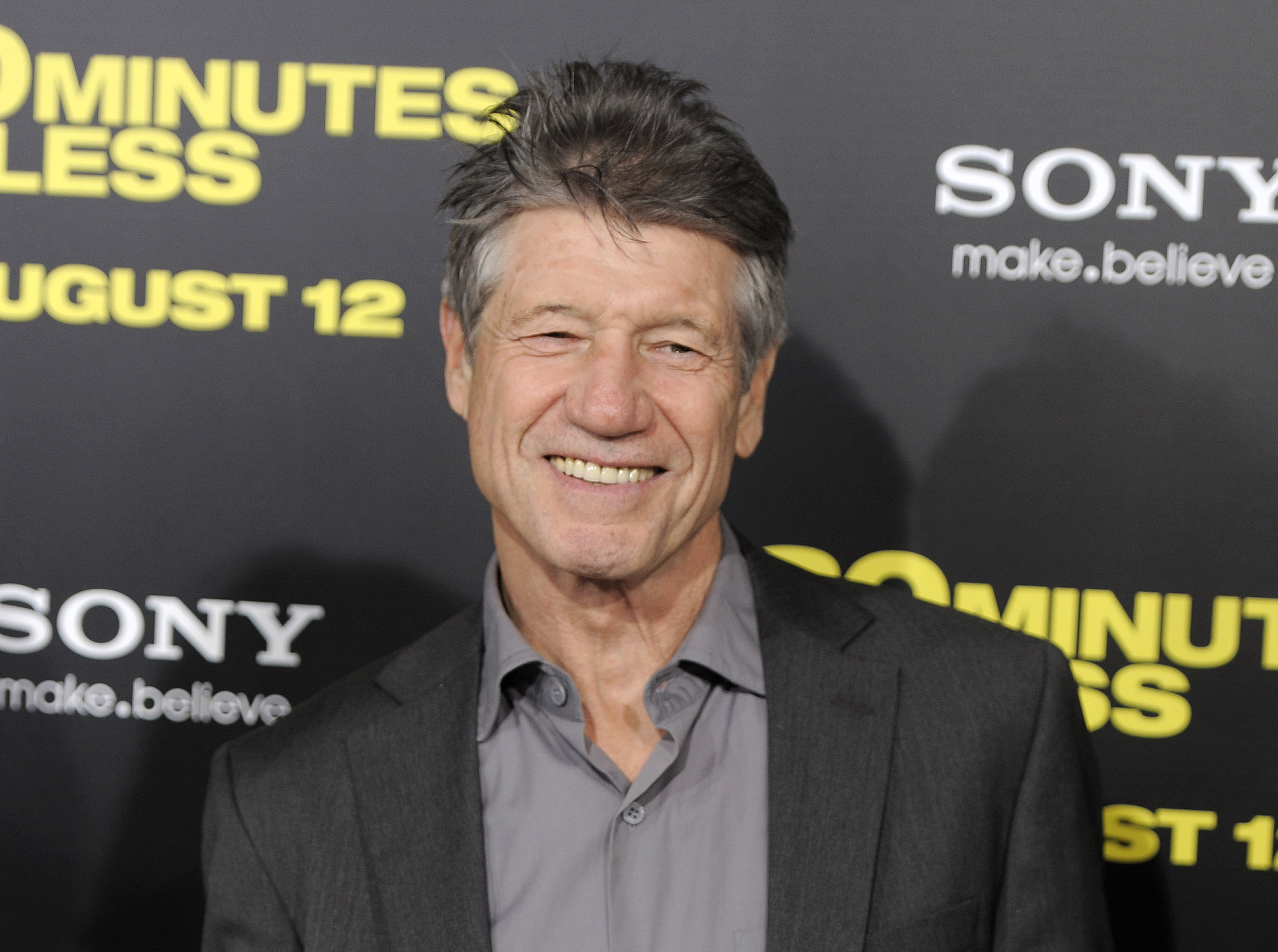 FILE - Fred Ward, a cast member in "30 Minutes or Less," poses at the premiere of the film in Los Angeles on Aug. 8, 2011. Ward, a veteran actor who brought a gruff tenderness to tough-guy roles in such films as “The Right Stuff,” “The Player” and “Tremors,” died Sunday, May 8, his publicist Ron Hofmann said Friday, May 13, 2022. He was 79. (AP Photo/Chris Pizzello, File)
