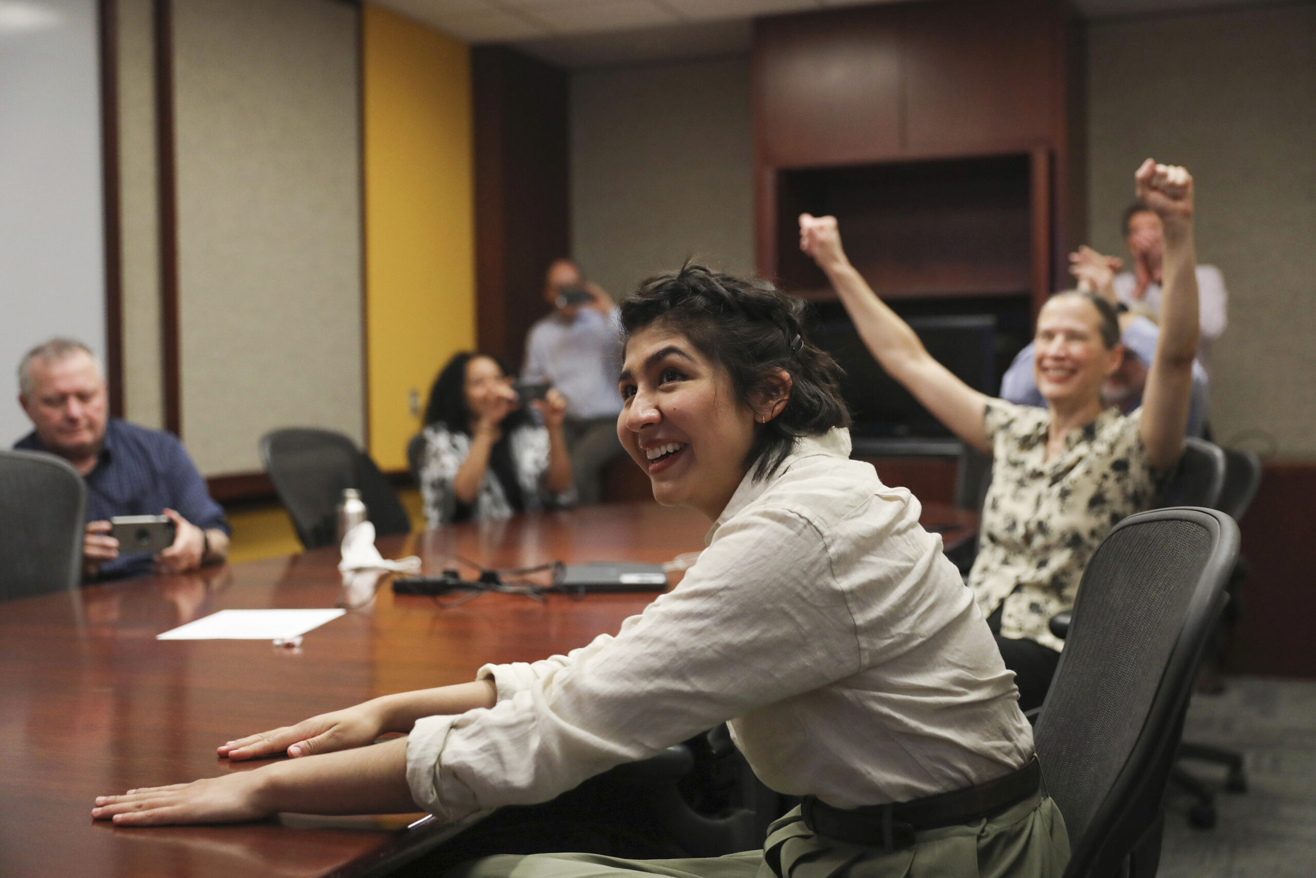 Cecilia Reyes, of the Chicago Tribune, reacts as she and Madison Hopkins of the Better Government Association, not pictured, win the Pulitzer Prize in Local Reporting at the Chicago Tribune's Freedom Center in Chicago, Monday, May 9, 2022. (Jose M. Osorio/Chicago Tribune via AP)