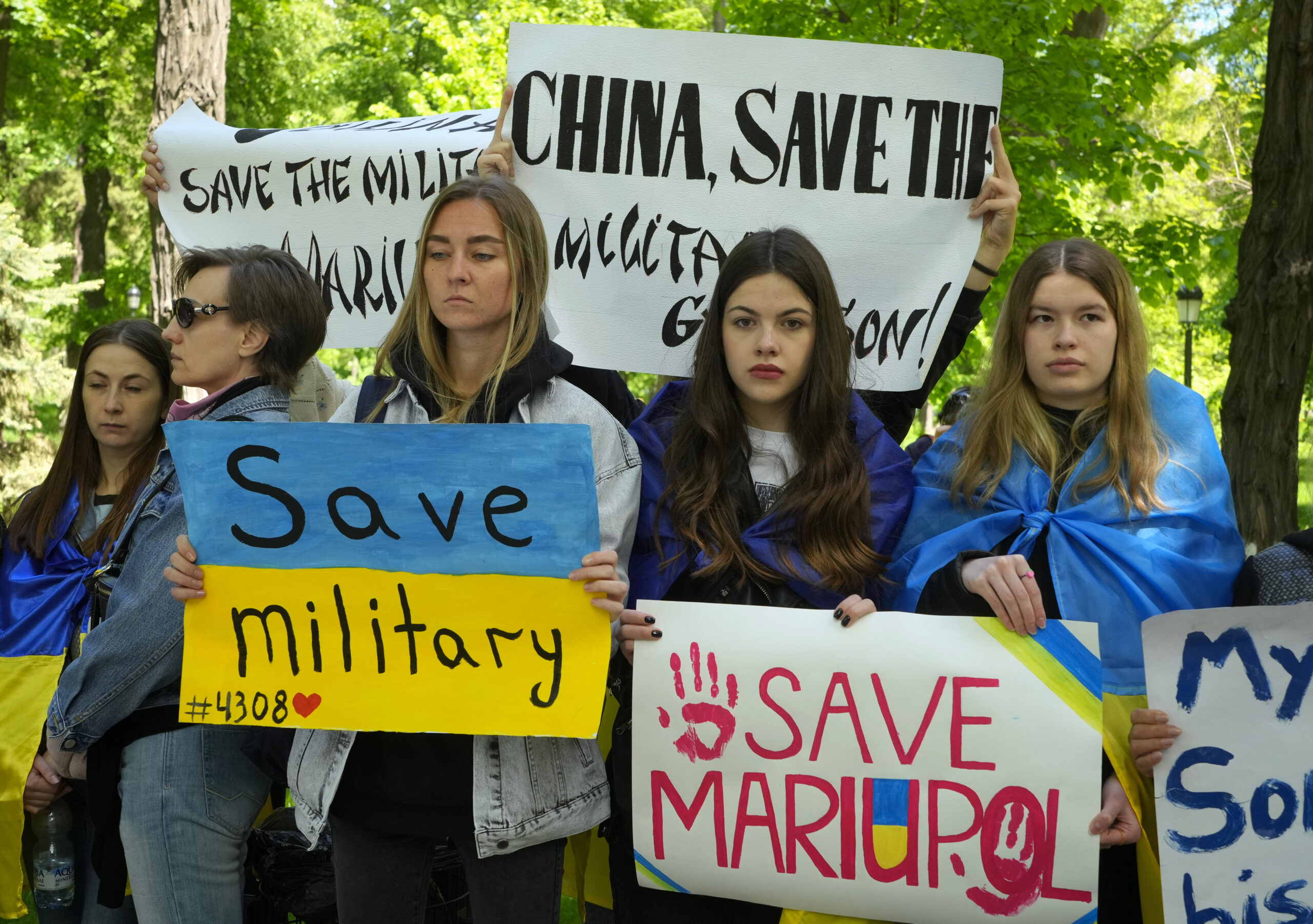 Ukrainian women picket in front of the Chinese embassy in Kyiv, Ukraine, Tuesday, May 17, 2022. Wives and mothers of the defenders of Mariupol call on Turkish President Recep Tayyip Erdogan and Chinese President Xi Jinping to save Ukrainian fighters from the besieged city of Mariupol amid Russia's war. (AP Photo/Efrem Lukatsky)