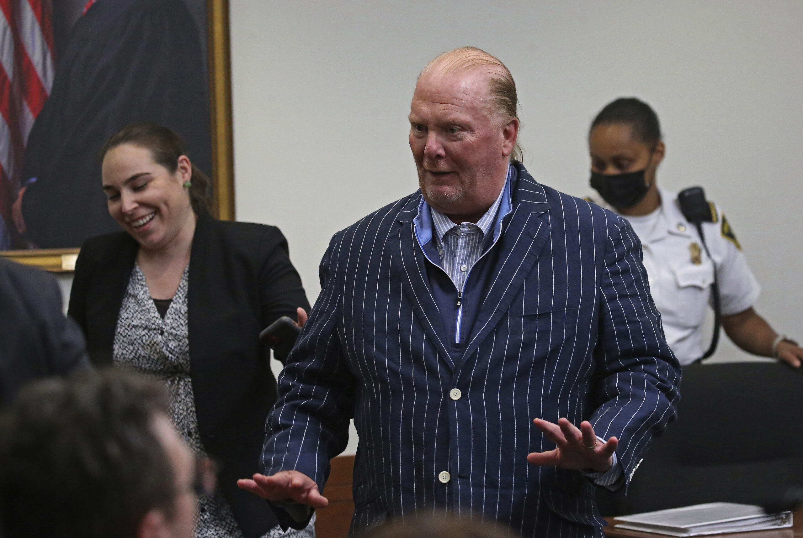 Celebrity chef Mario Batali reacts after being found not guilty of indecent assault and battery at Boston Municipal Court on the second day of his trial, on Tuesday, May 10, 2022 in Boston. Batali, who pleaded not guilty to indecent assault and battery in 2019, had faced up to 2 1/2 years in jail and would’ve been required to register as a sex offender if convicted. (Stuart Cahill/The Boston Herald via AP, Pool)