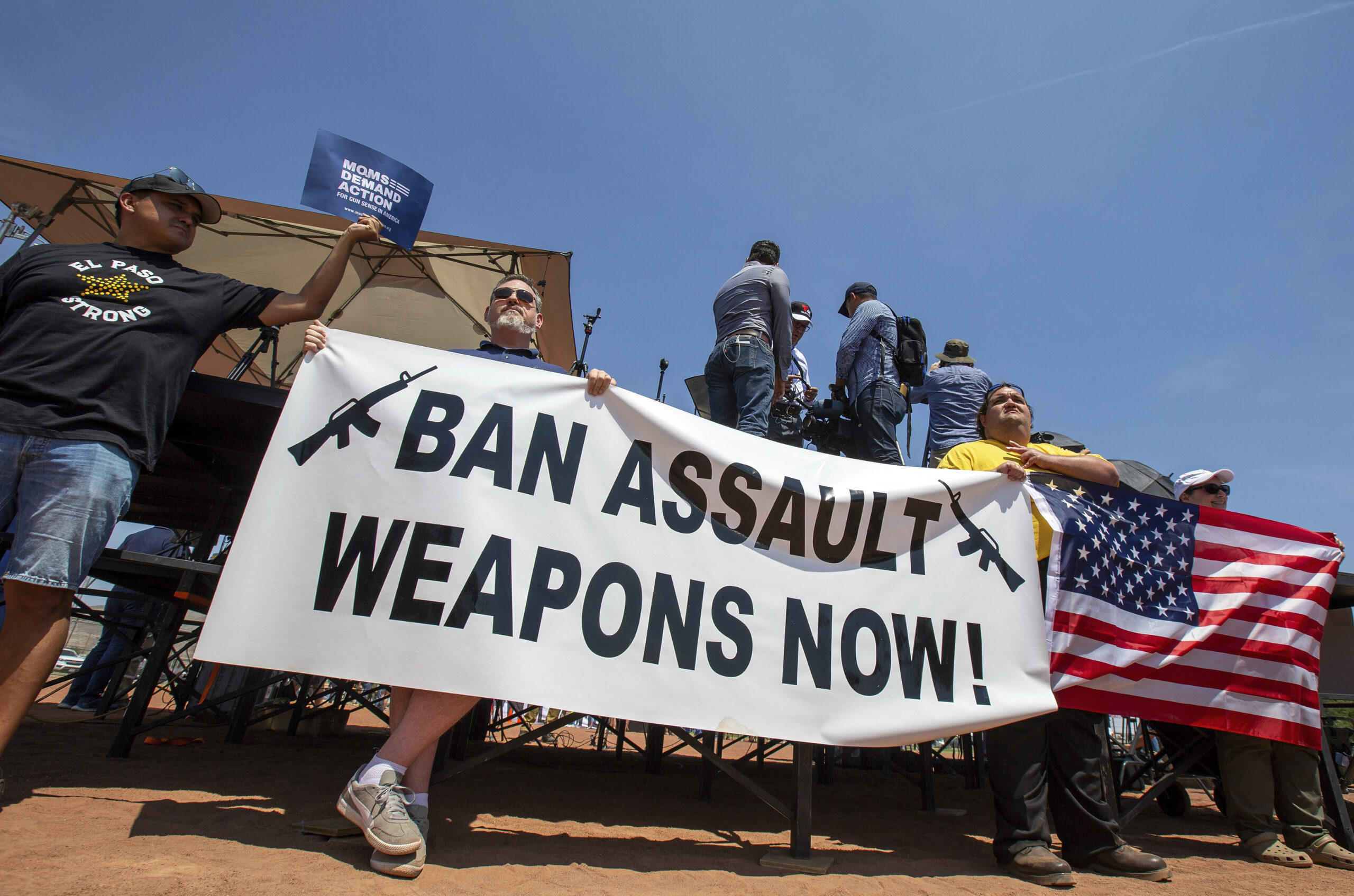 FILE - Demonstrators hold a banner to protest the visit of President Donald Trump to the border city after the Aug. 3 mass shooting in El Paso, Texas, on Aug. 7, 2019. A gunman killing multiple elementary school children and adults in Texas on Tuesday, May 24, 2022, adds to the state's grim recent history of mass shootings. (AP Photo/Andres Leighton, File)