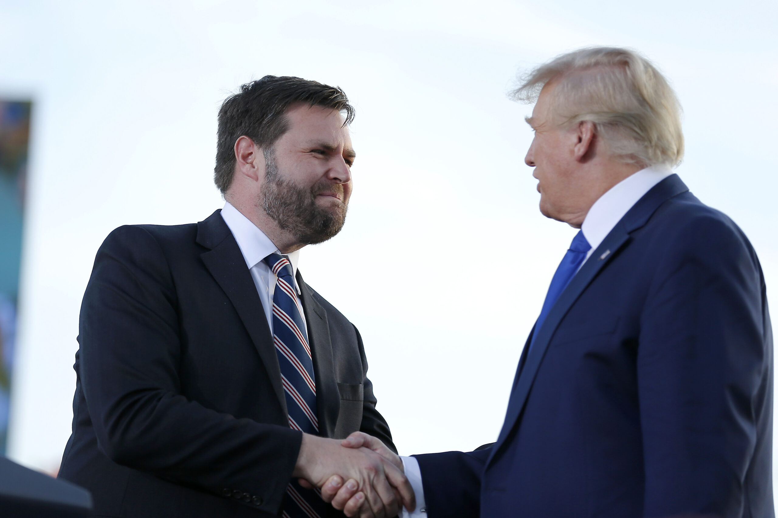 Senate candidate JD Vance, left, greets former President Donald Trump at a rally at the Delaware County Fairgrounds, Saturday, April 23, 2022, in Delaware, Ohio, to endorse Republican candidates ahead of the Ohio primary on May 3. (AP Photo/Joe Maiorana)