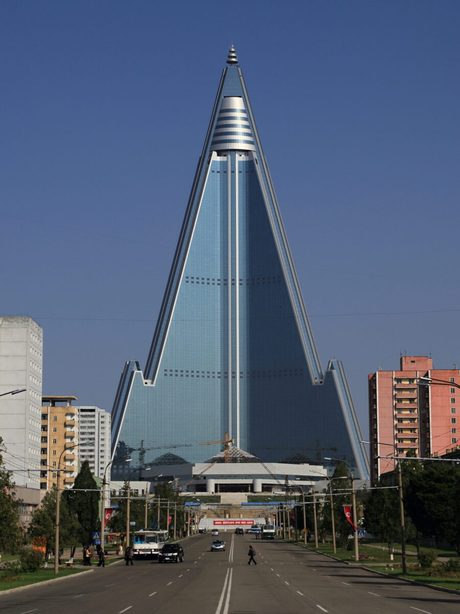 The Ryugyong Hotel picture of the pyramid building in a sand dune or dirt hill originally came from an illustration from Nicolas Moulin.