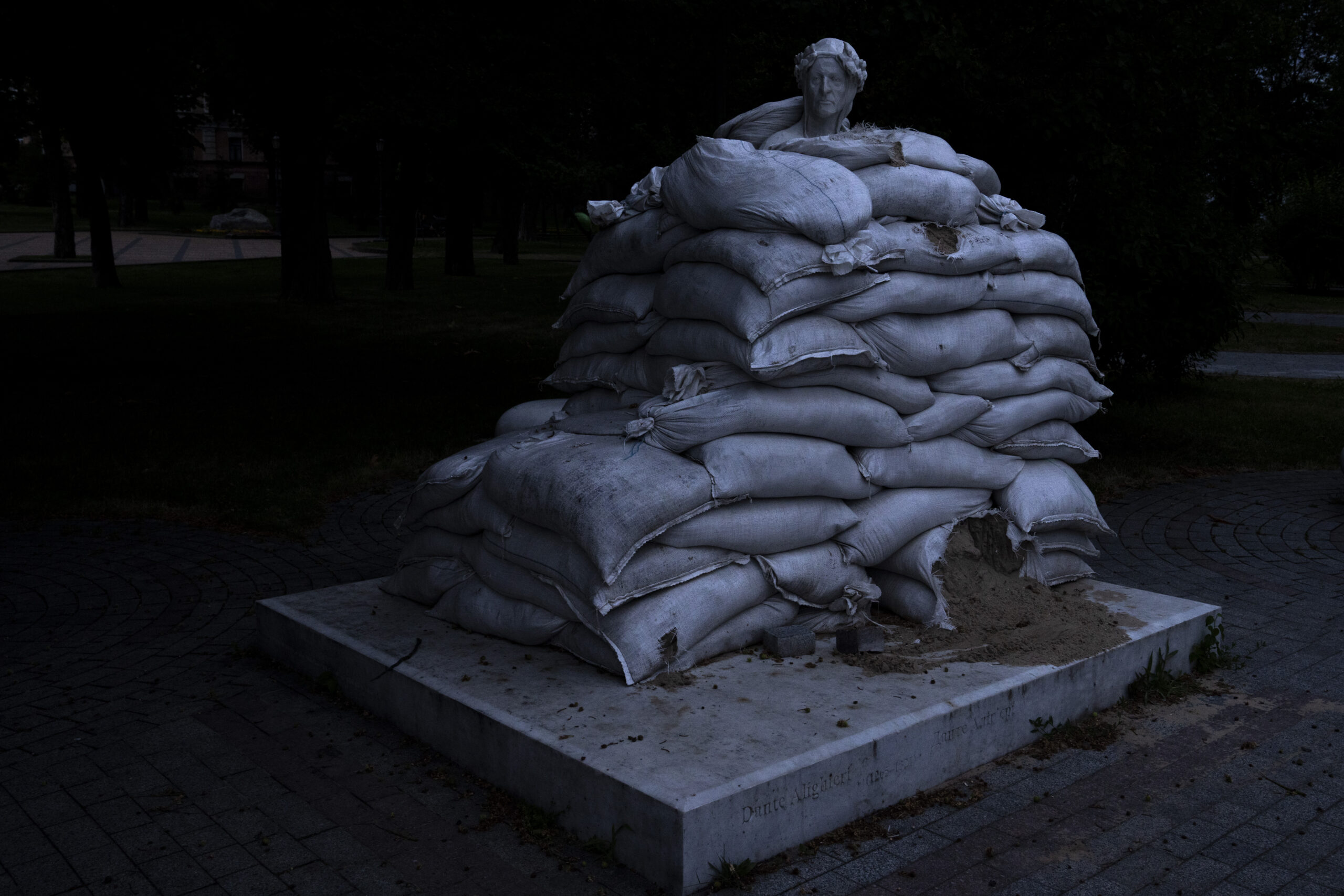 The sculpture of prominent Italian poet Dante Alighieri, is protected by sandbags, on Vladimir's Hill in Kyiv, Ukraine, Thursday, June 23, 2022. (AP Photo/Nariman El-Mofty)