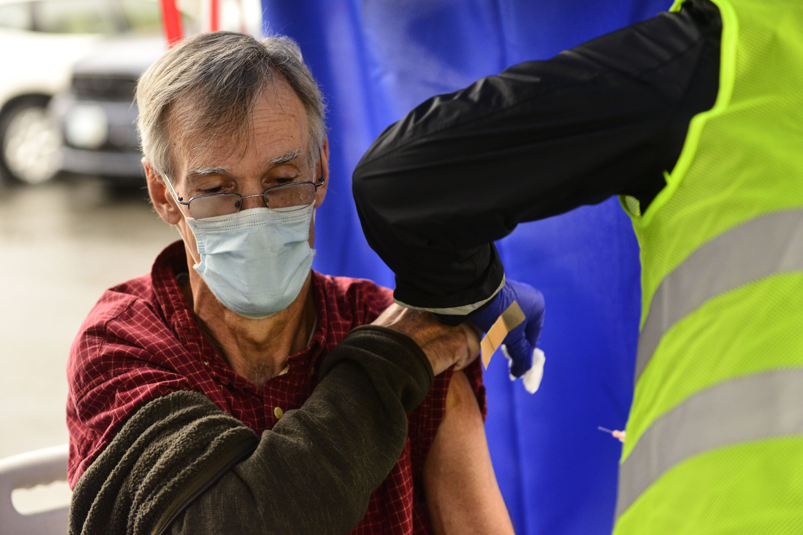 FILE - Crager Boardman, from Brattleboro, Vt., receives a shot at a flu vaccine clinic in Brattleboro on Tuesday, Oct. 26, 2021. On Wednesday, June 22, 2022, a federal advisory panel says Americans 65 and older should get newer, souped-up flu vaccines. The panel unanimously recommended certain flu vaccines for seniors, whose weakened immune systems don’t respond as well to traditional shots. (Kristopher Radder/The Brattleboro Reformer via AP, File)