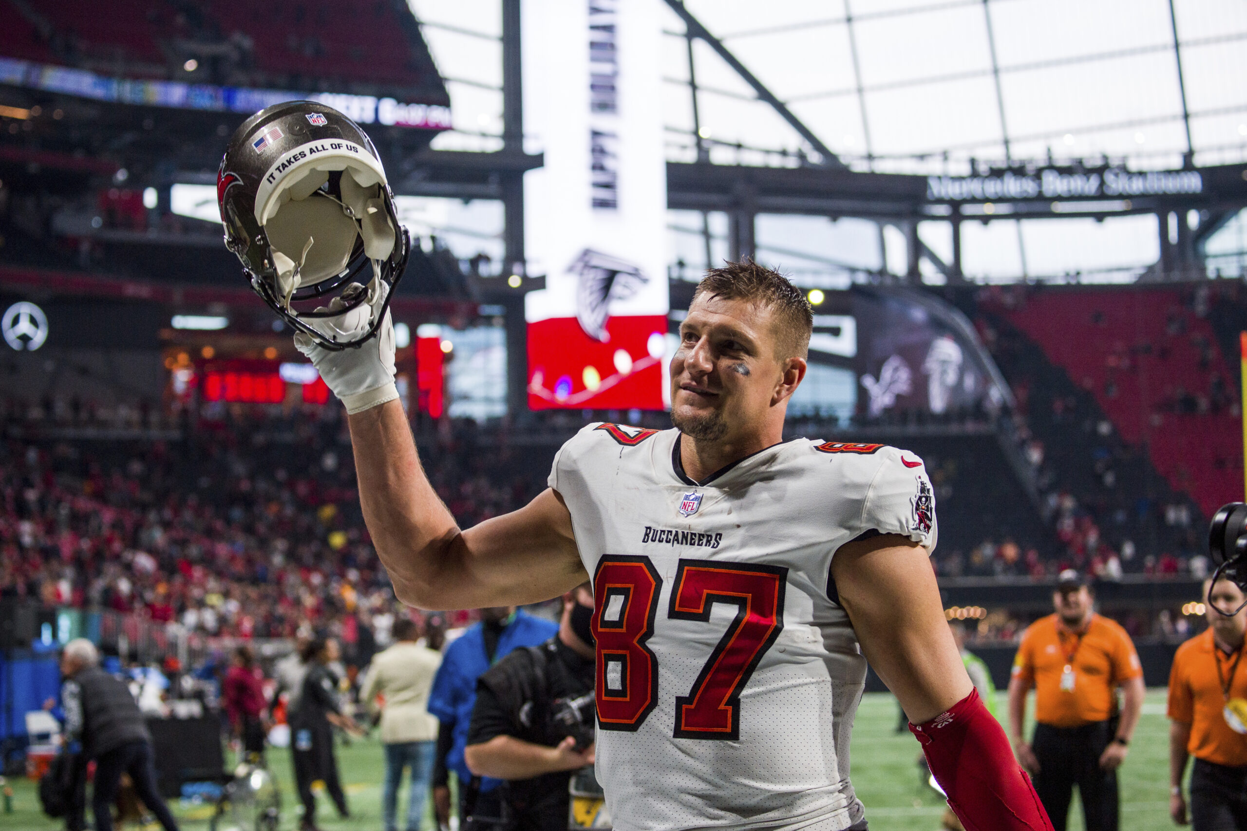 FILE - Tampa Bay Buccaneers tight end Rob Gronkowski (87) waves to fans after an NFL football game, Sunday, Dec. 5, 2021, in Atlanta. The Tampa Bay Buccaneers won 30-17. Four-time All-Pro tight end Rob Gronkowski announced his retirement again, Tuesday, June 21, 2022. (AP Photo/Danny Karnik, File)
