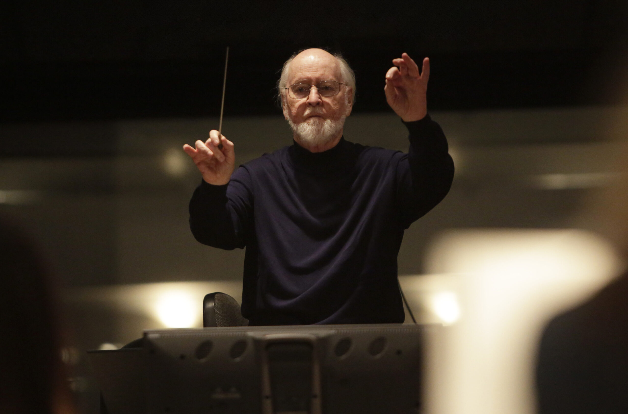 This 2017 photo released by Lucasfilm Ltd. shows John Williams, a five-time Oscar-winning composer. Williams, 90, is devoting himself to composing concert music, including a piano concerto he’s writing for Emanuel X. This spring, he and cellist Yo-Yo Ma released the album “A Gathering of Friends,” recorded with the New York Philharmonic. (Jamie Trueblood/Lucasfilm Ltd. via AP)